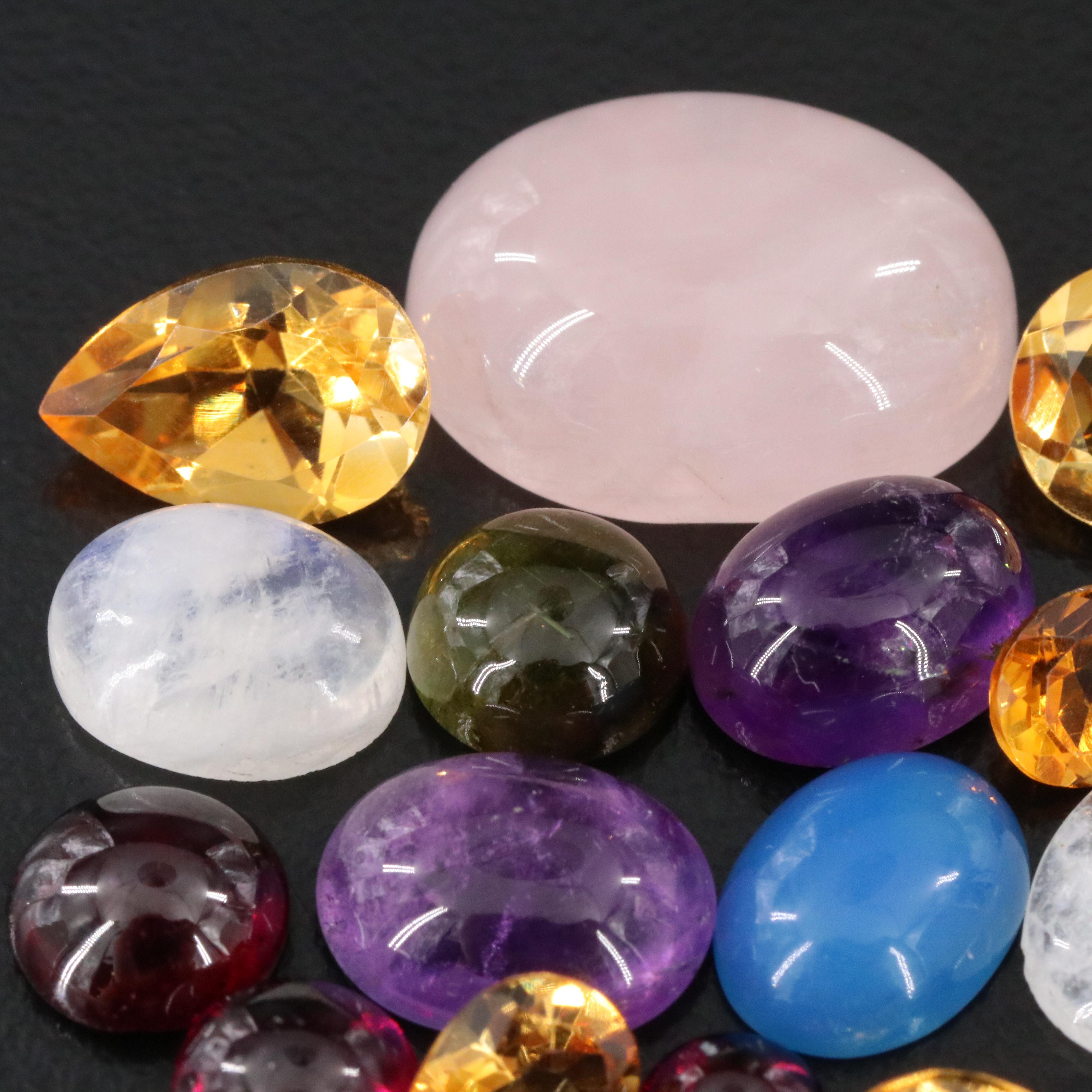 Loose 34.41 CTW Gemstone Lot Including Rose Quartz, Rainbow Moonstone and Garnet