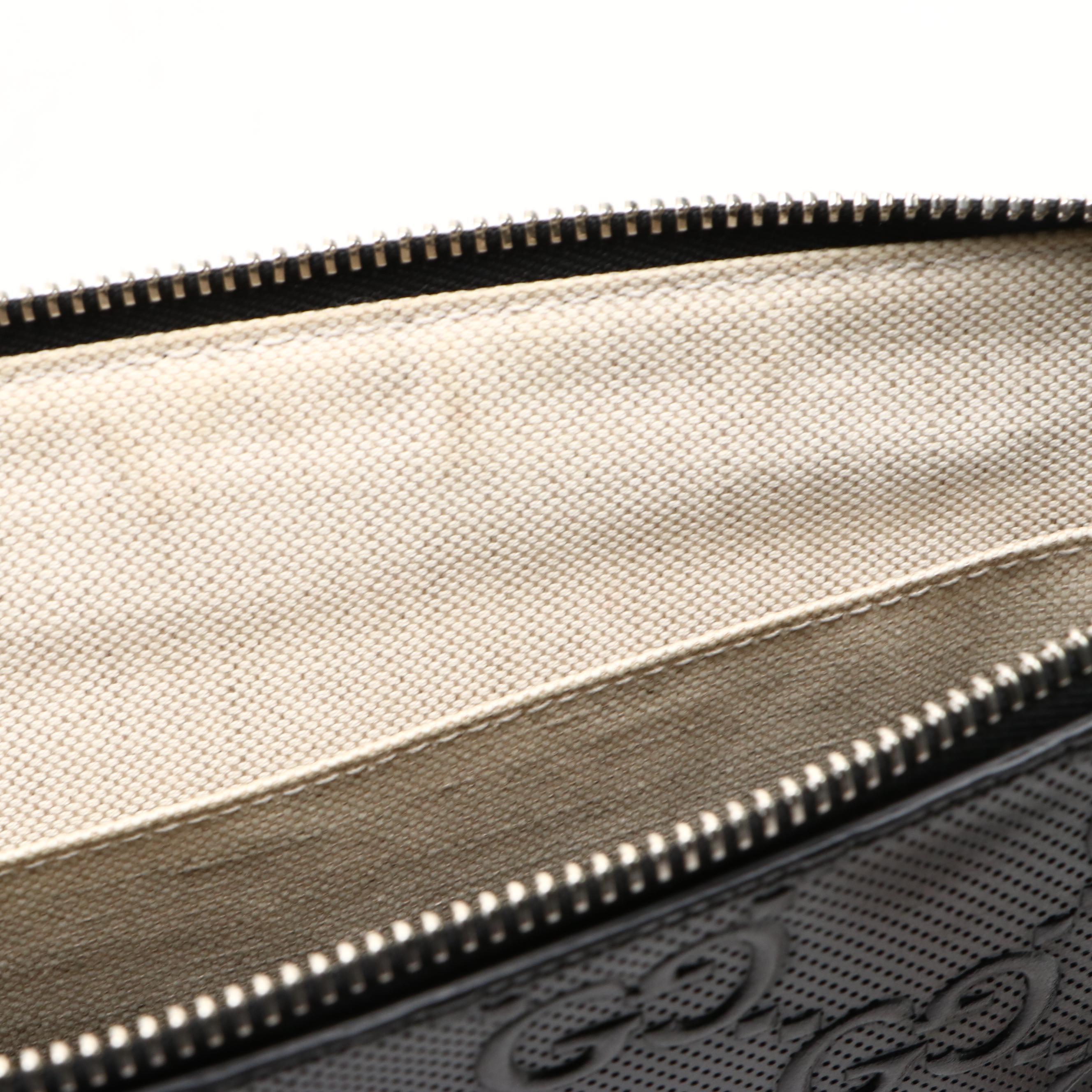 Gucci Zip Wristlet Clutch in Black Perforated GG Embossed Leather