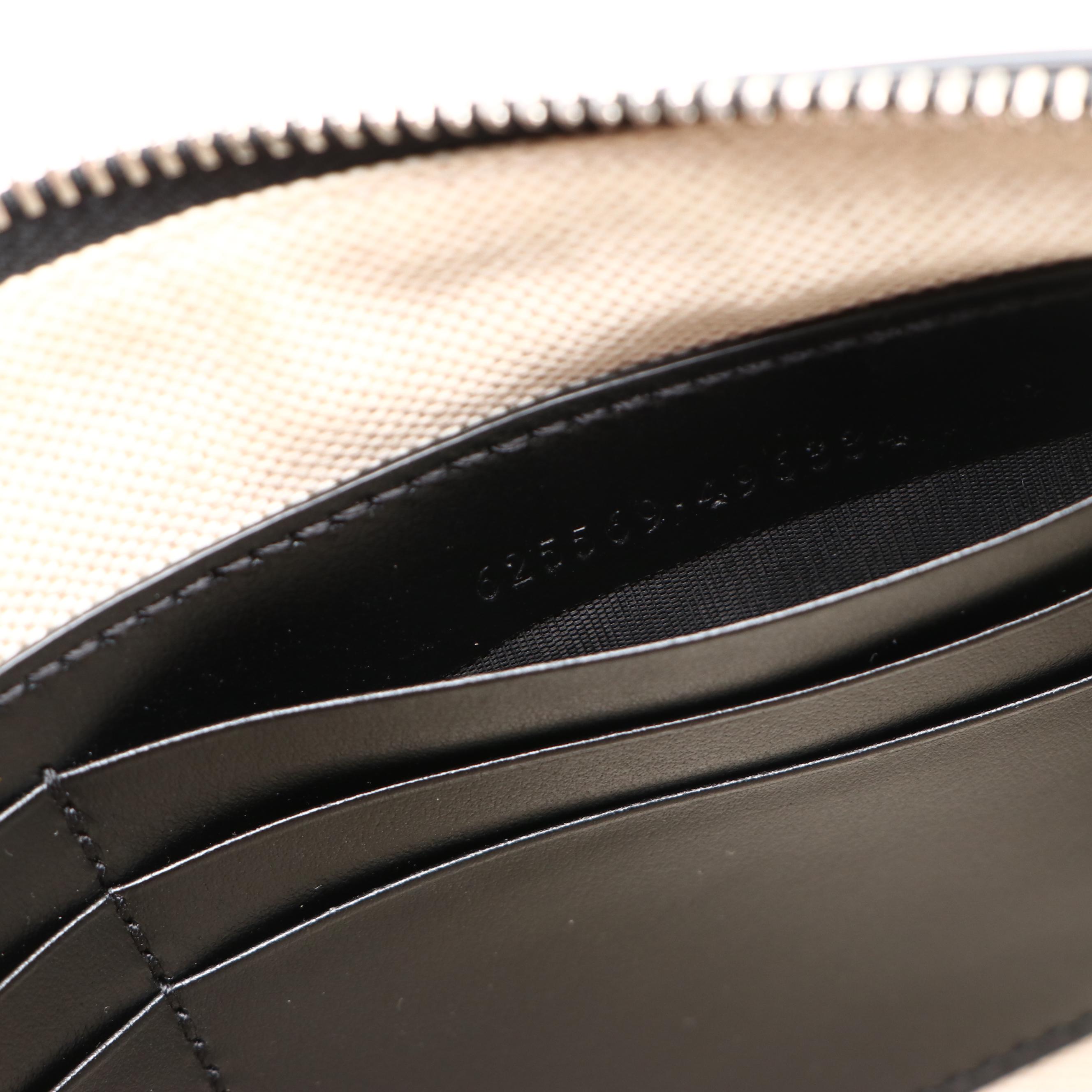 Gucci Zip Wristlet Clutch in Black Perforated GG Embossed Leather