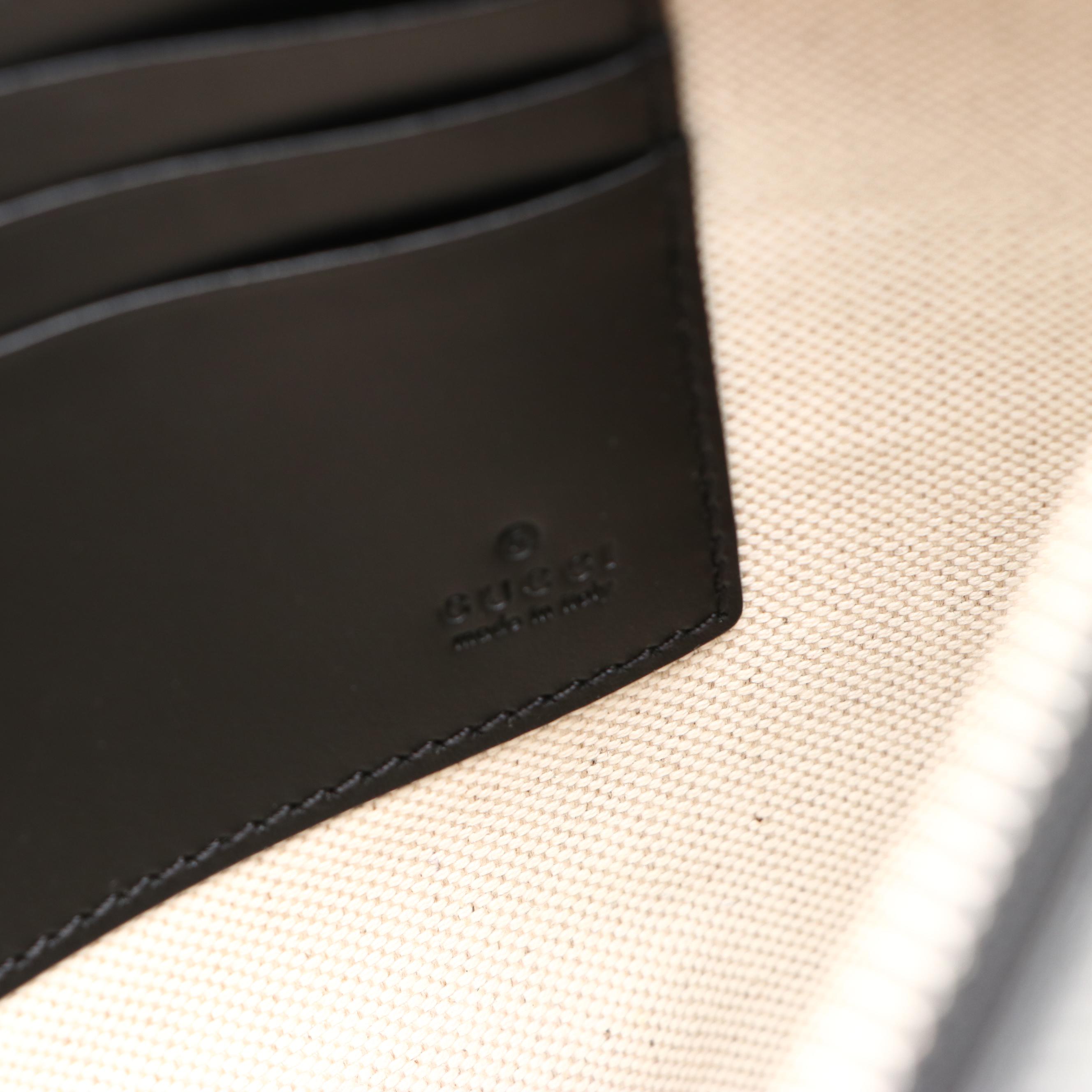 Gucci Zip Wristlet Clutch in Black Perforated GG Embossed Leather