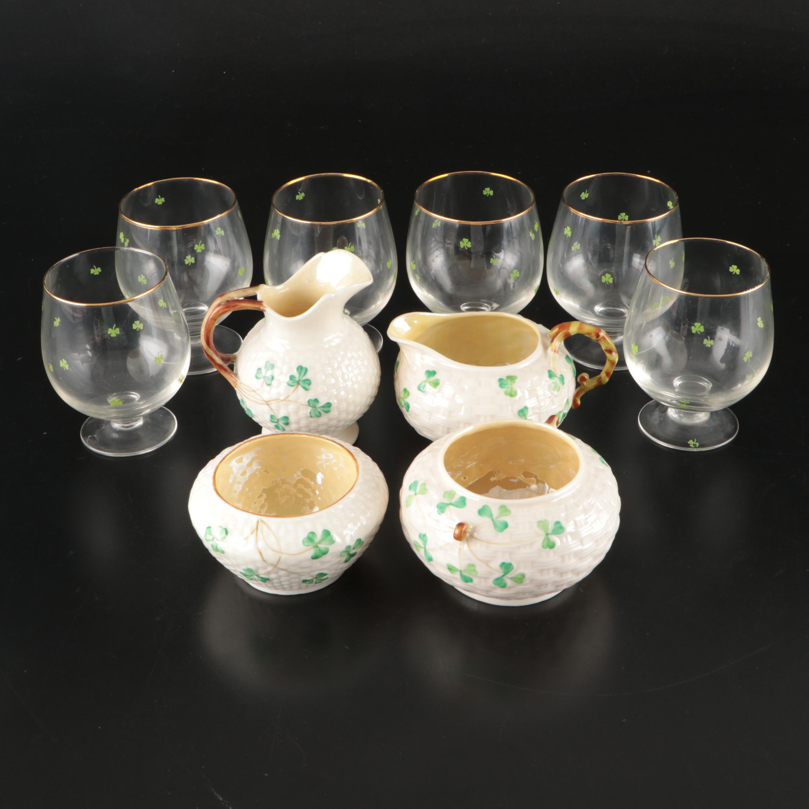 Belleek Ceramic Creamers and Sugar Bowls with Waterford Gilt Brandy Glasses