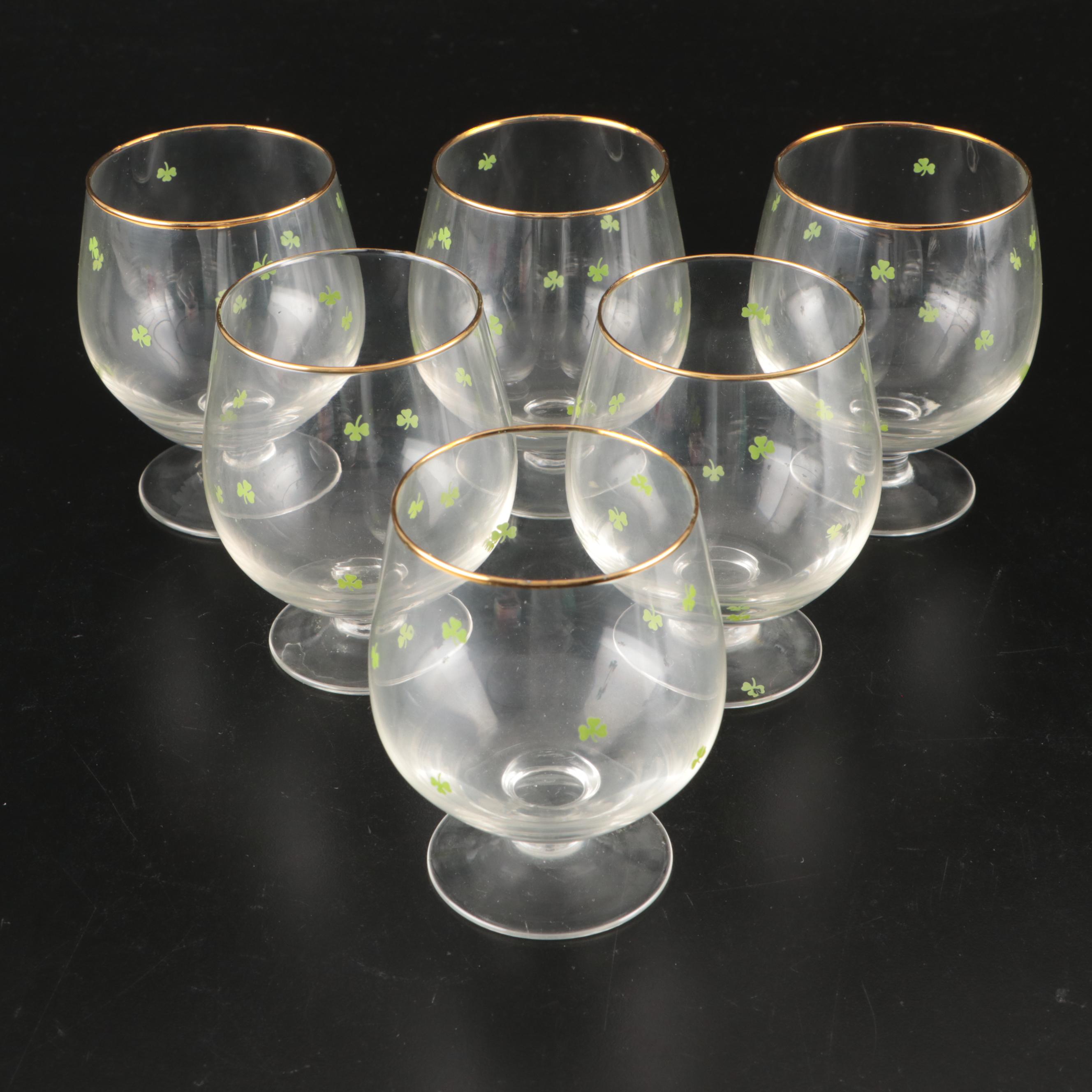 Belleek Ceramic Creamers and Sugar Bowls with Waterford Gilt Brandy Glasses