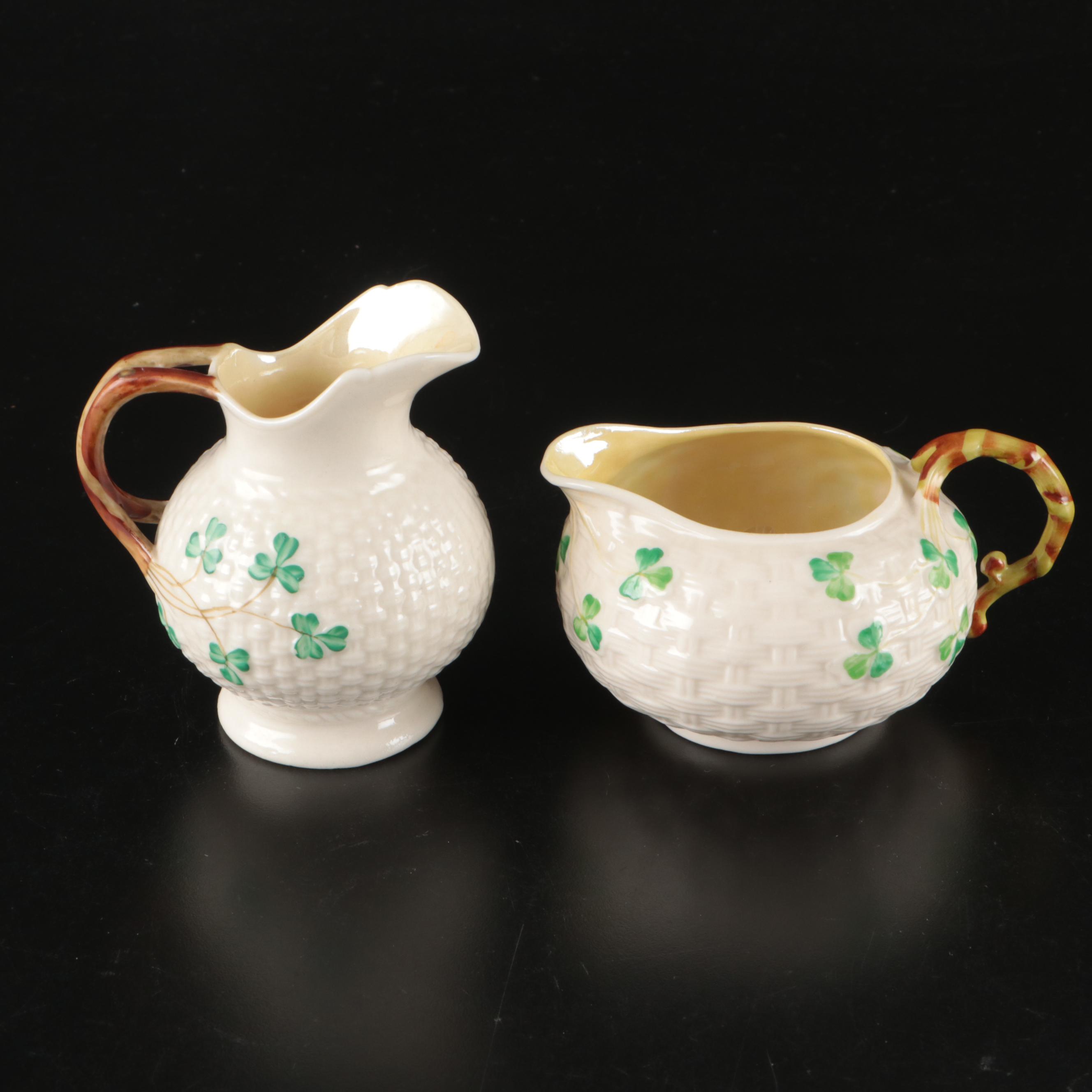 Belleek Ceramic Creamers and Sugar Bowls with Waterford Gilt Brandy Glasses