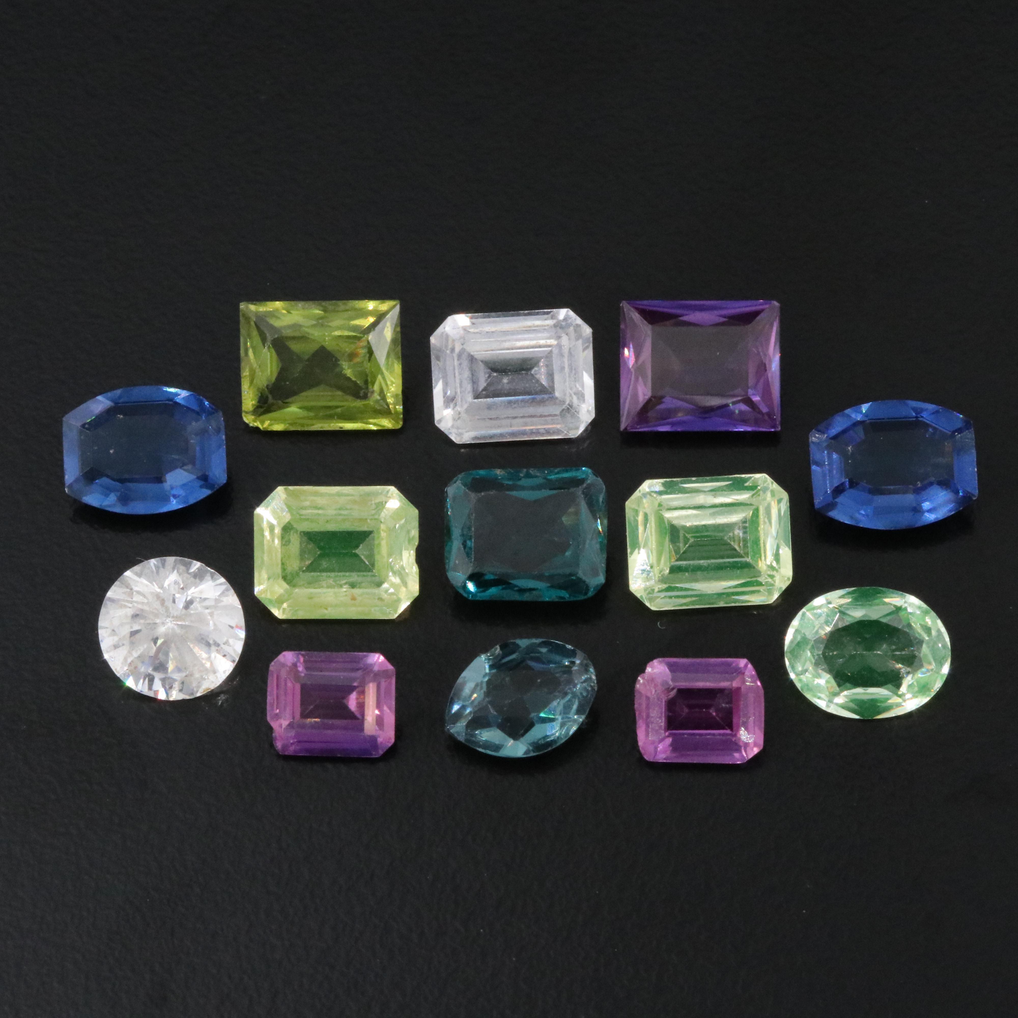 Loose 37.82 CTW Gemstone Lot Including Lab Grown Spinel and Lab Grown Ruby