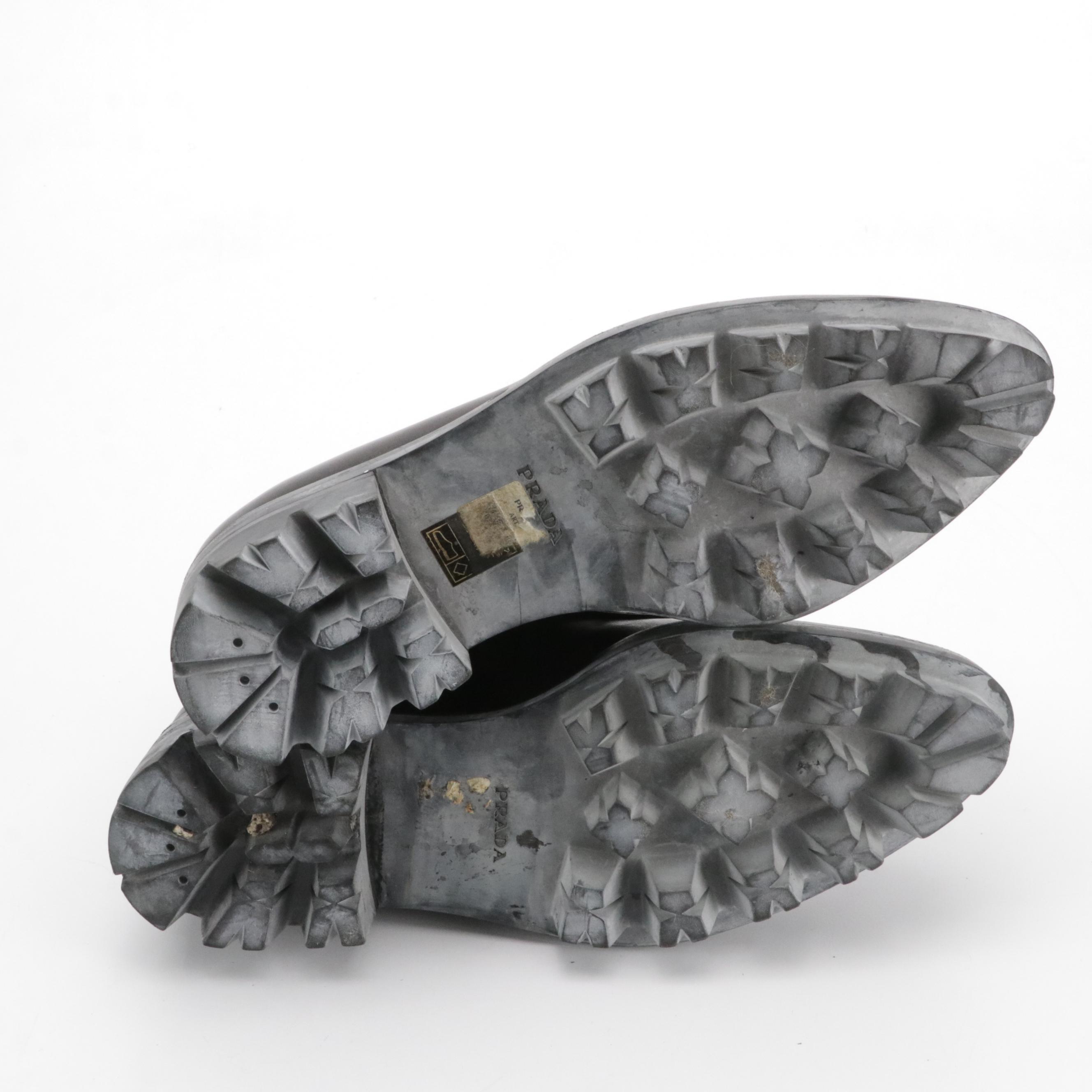 Prada Zipper-Front Buckle Strap Ankle Boots in Black Leather