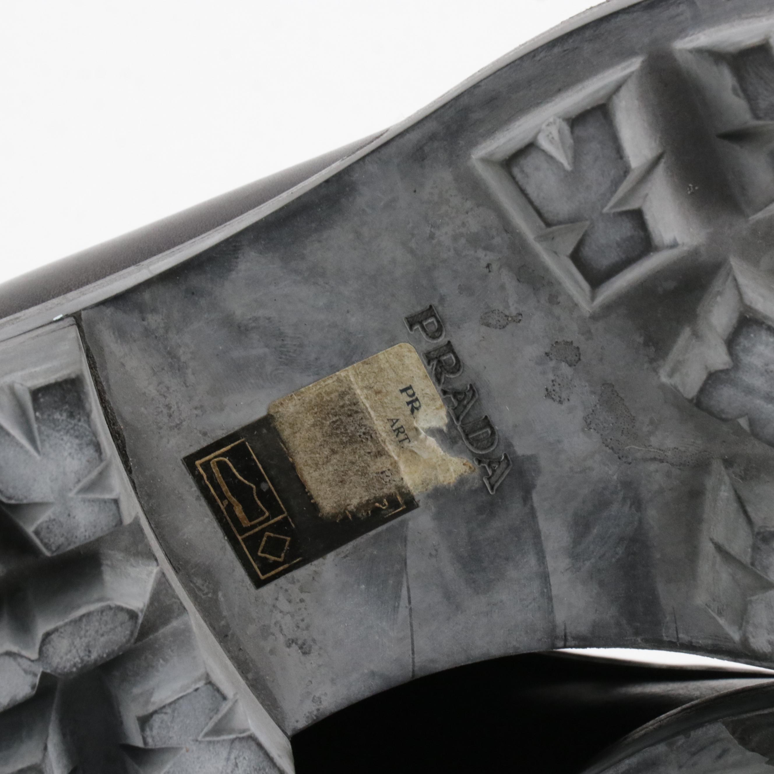 Prada Zipper-Front Buckle Strap Ankle Boots in Black Leather