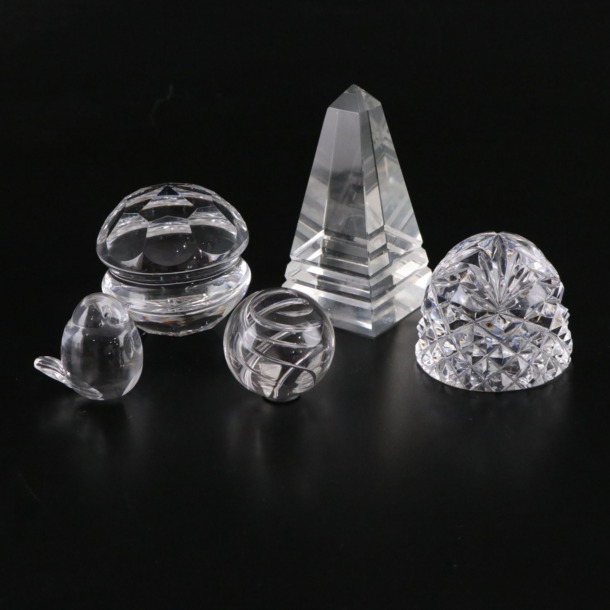 Crystal Ball and Four Crystal Paperweights