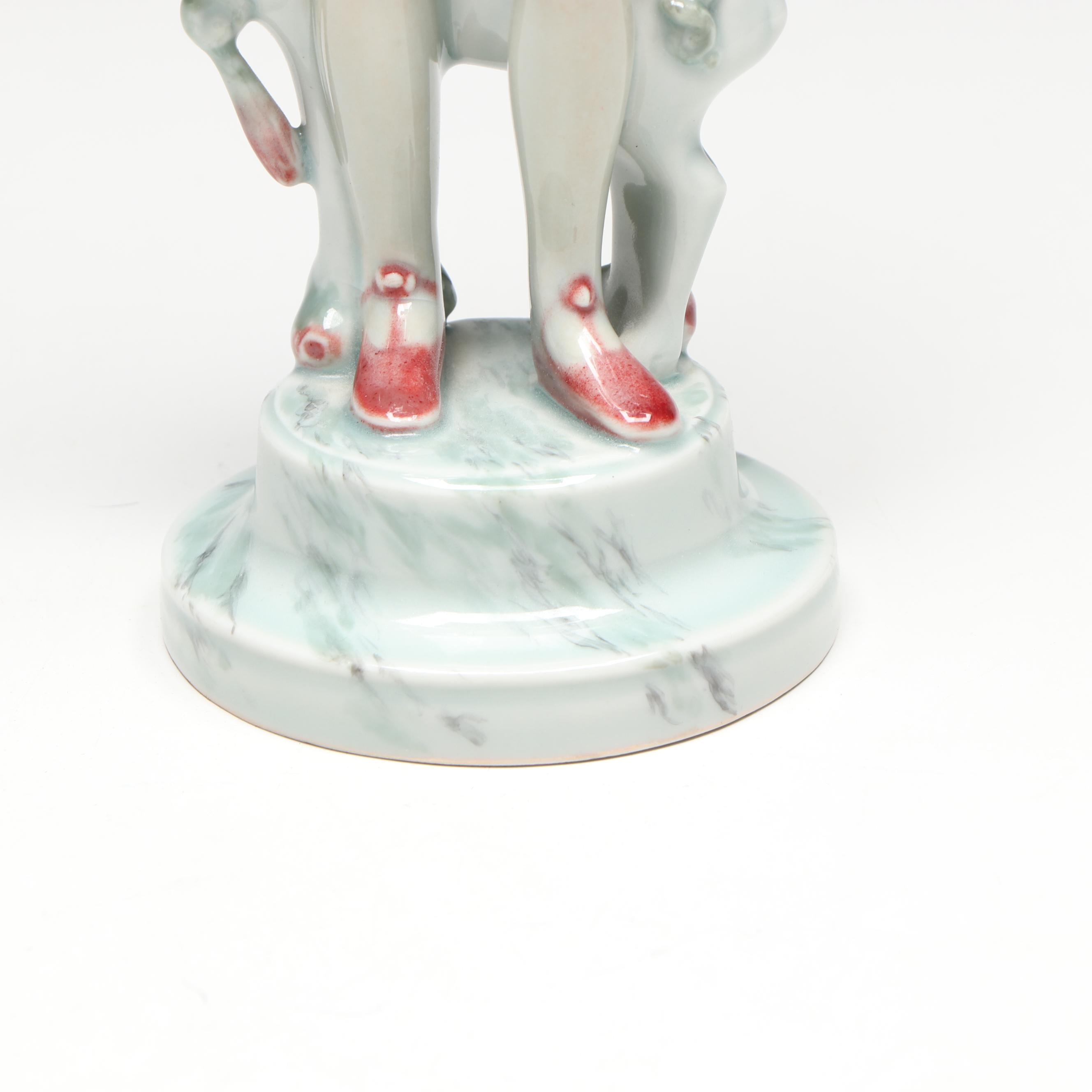 Georg Thylstrup for Royal Copenhagen Porcelain Woman and Dog Figurine