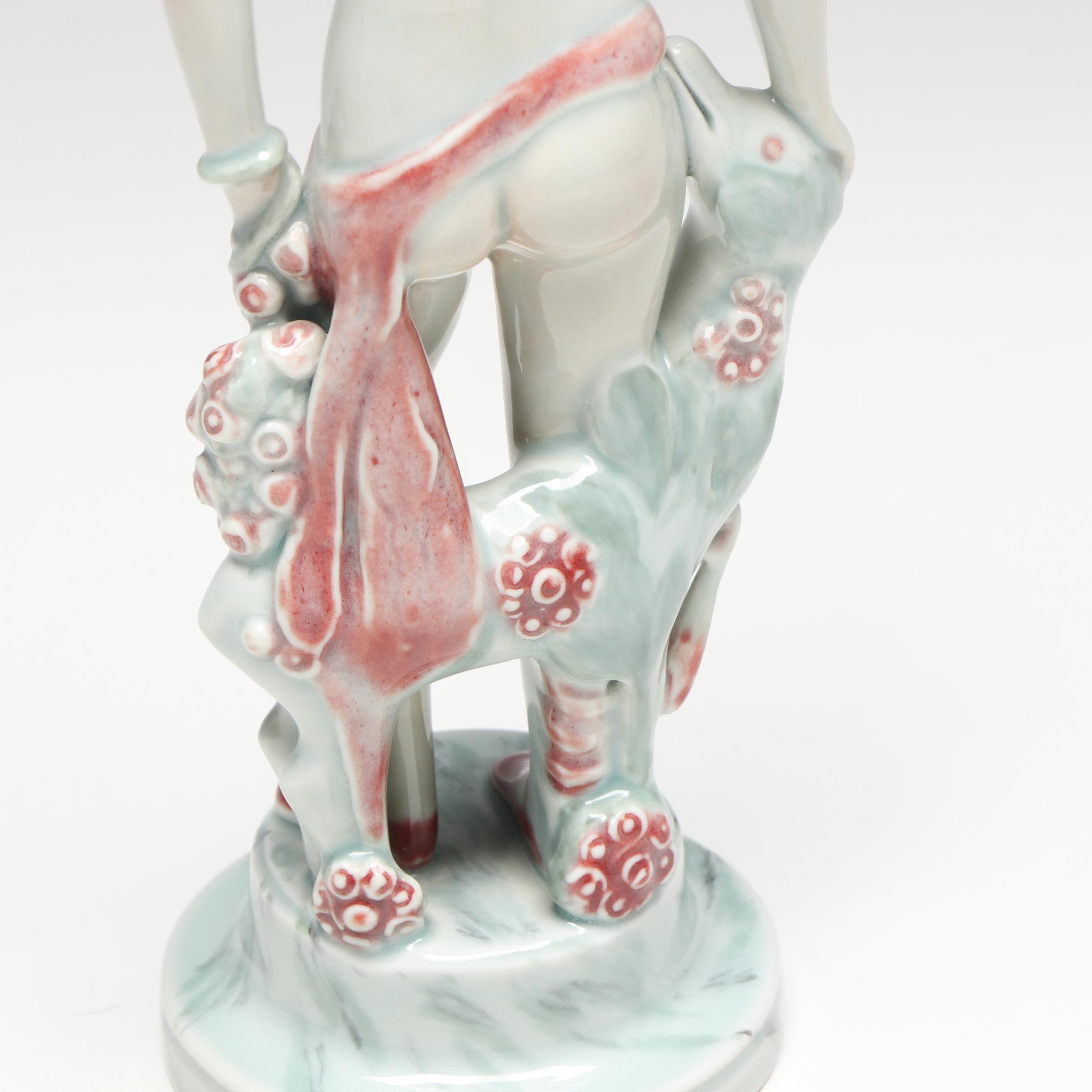 Georg Thylstrup for Royal Copenhagen Porcelain Woman and Dog Figurine