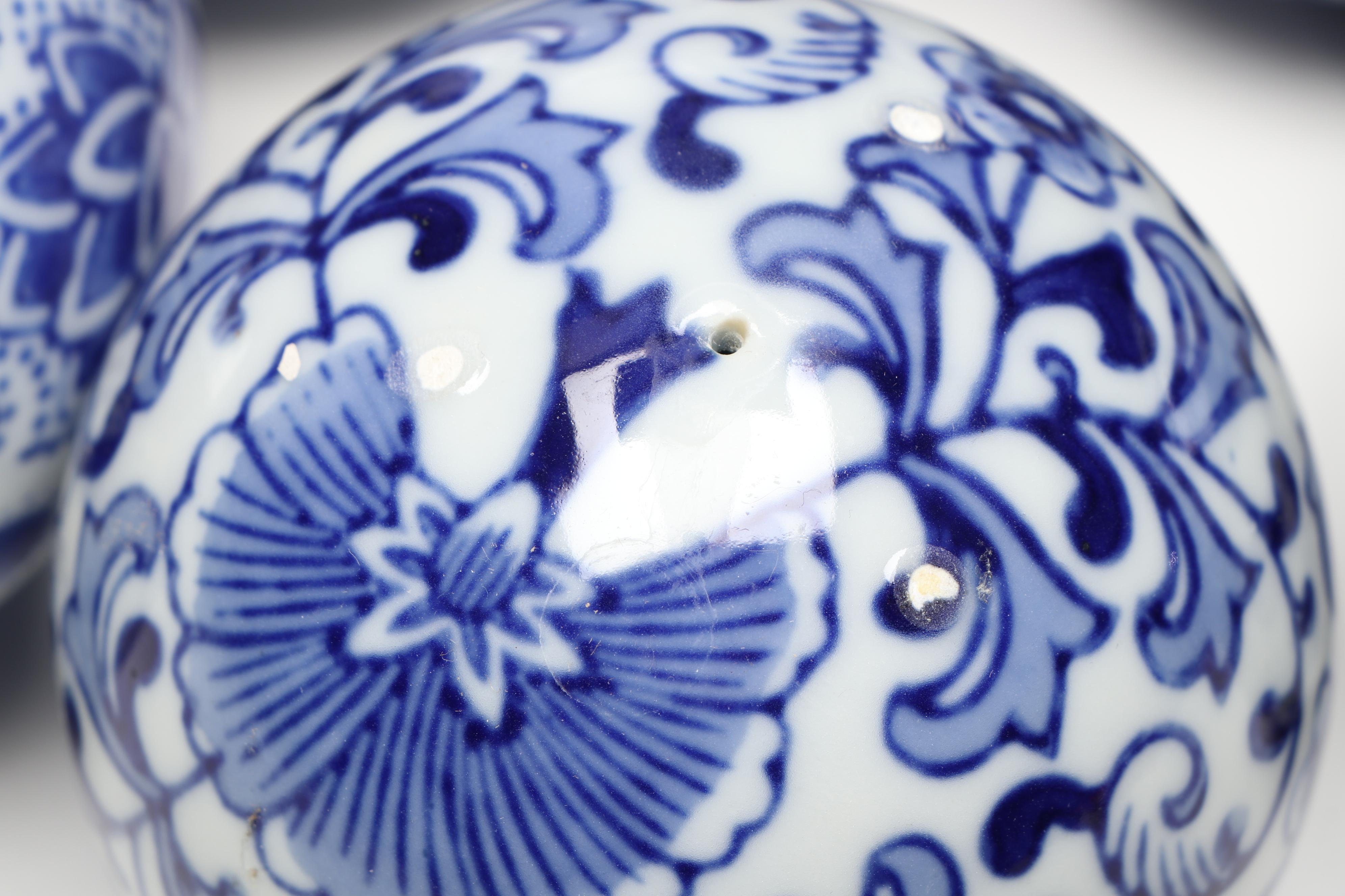 Blue and White Floral Ceramic Pitcher Vase with Carpet Balls