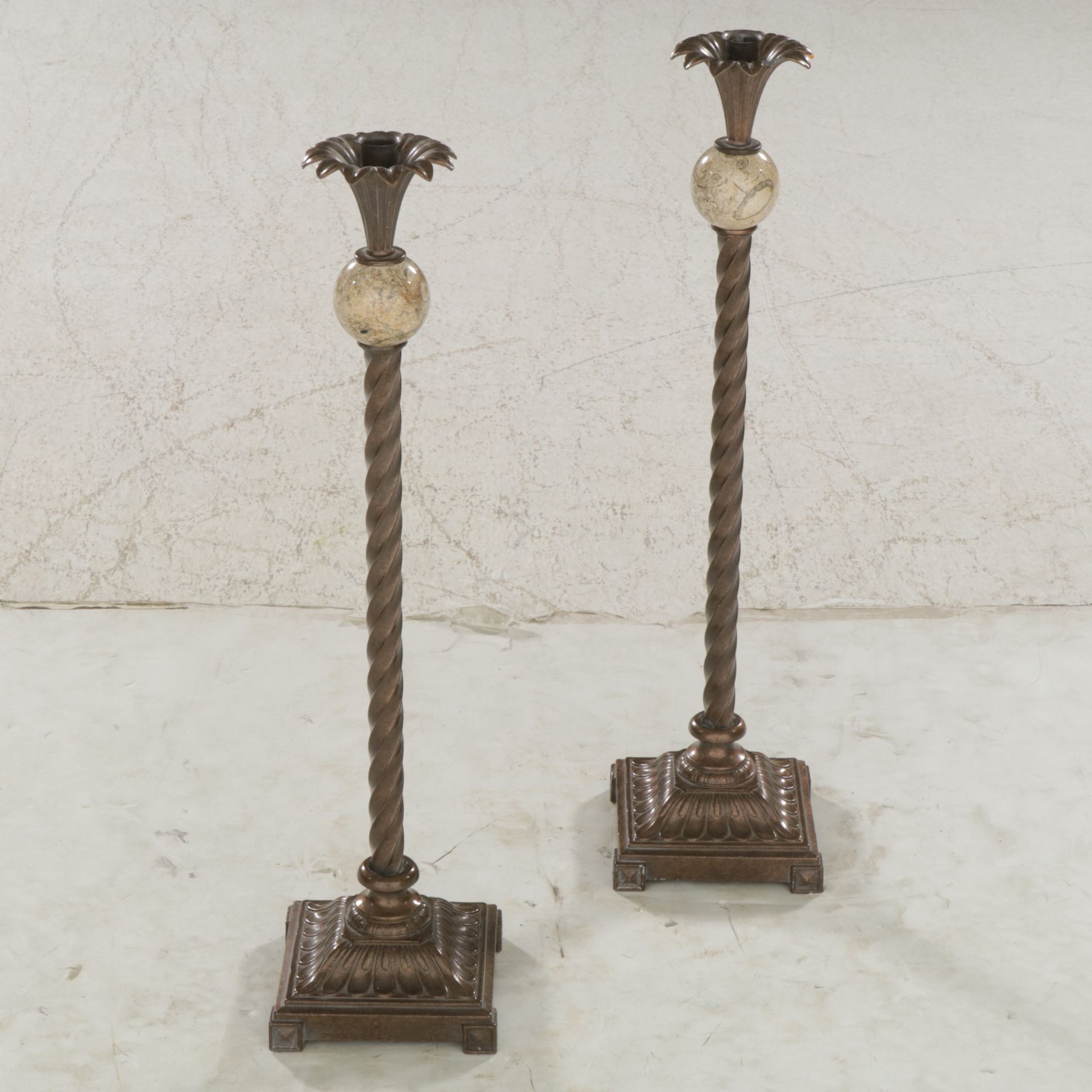Bronzed Metal Spiral and Travertine Orb Candlesticks