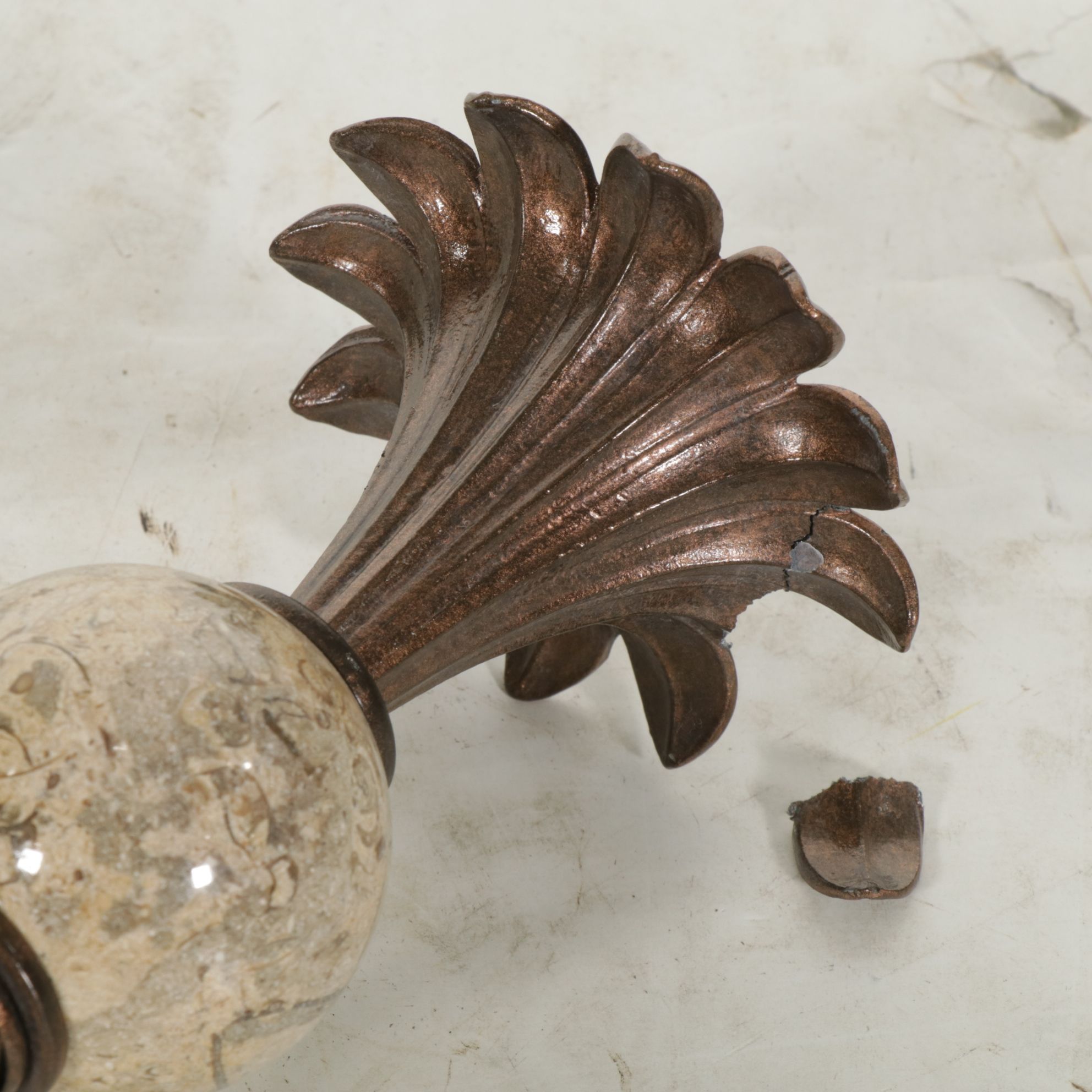 Bronzed Metal Spiral and Travertine Orb Candlesticks