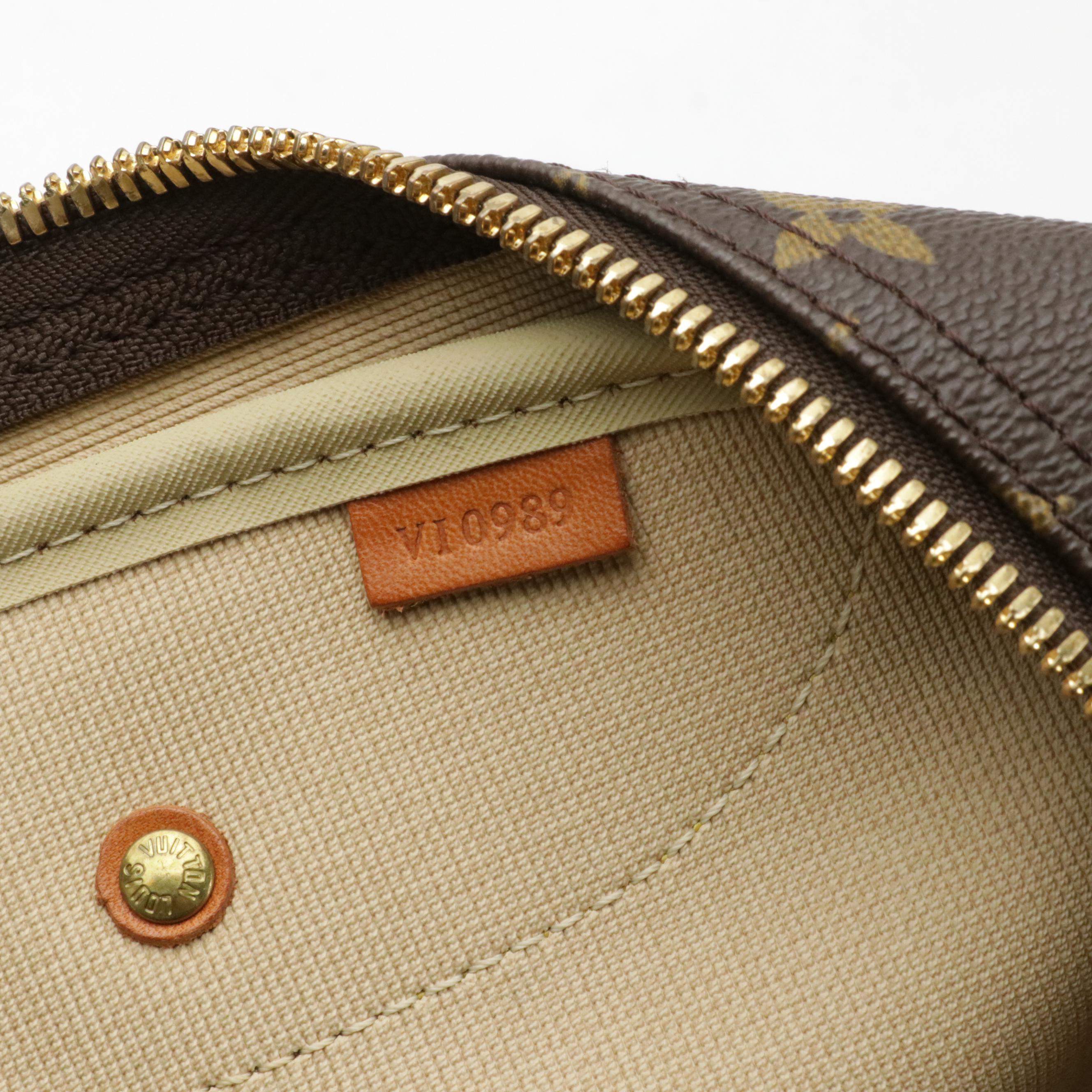 Louis Vuitton Evasion Travel Bag in Monogram Canvas and Vachetta Leather