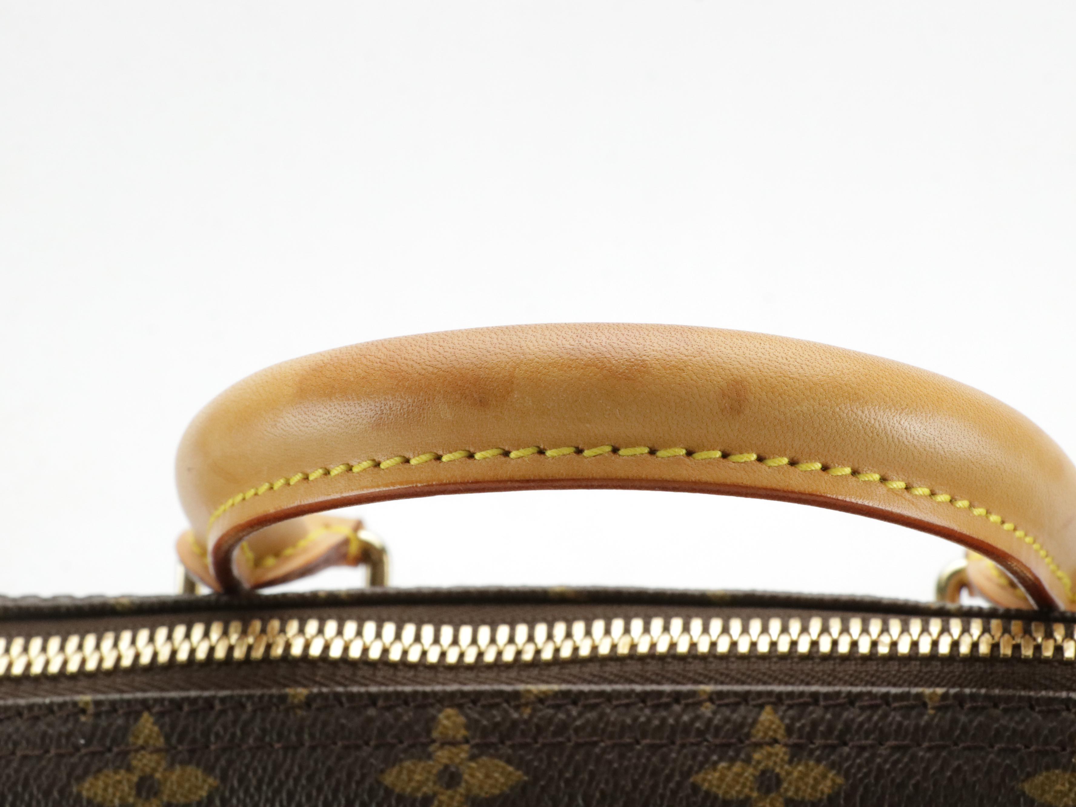 Louis Vuitton Evasion Travel Bag in Monogram Canvas and Vachetta Leather