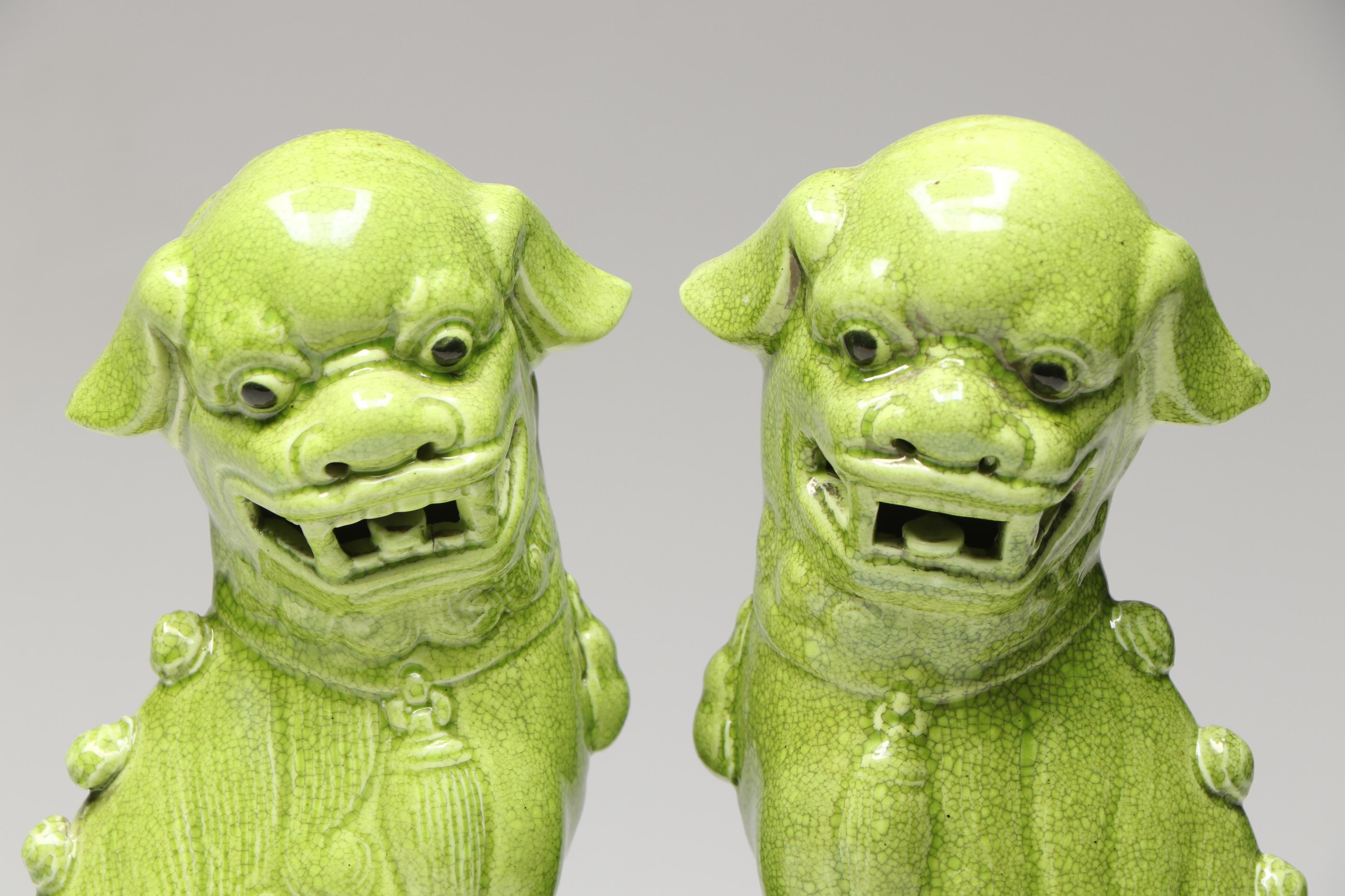 Pair of Chinese Style Green Crackle Glazed Ceramic Guardian Lion Figurines