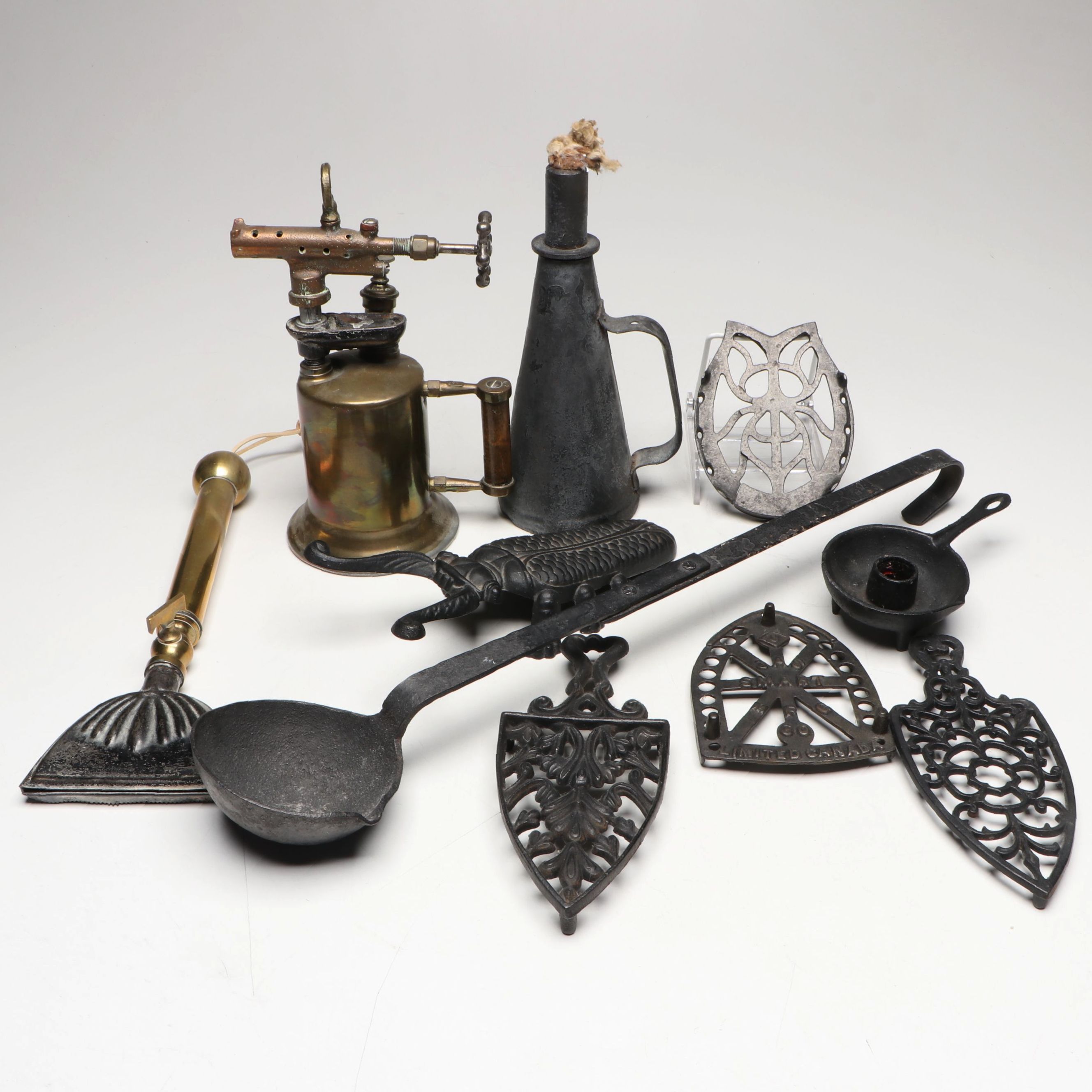 Cast Iron Trivets and Bootjack with Candleholder and More Metalware
