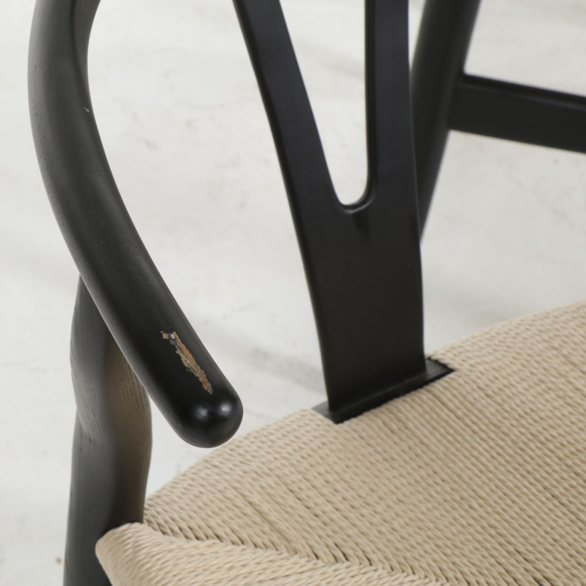 Four Modernist Black Wishbone Style Dining Chairs with Twisted Cord Seats