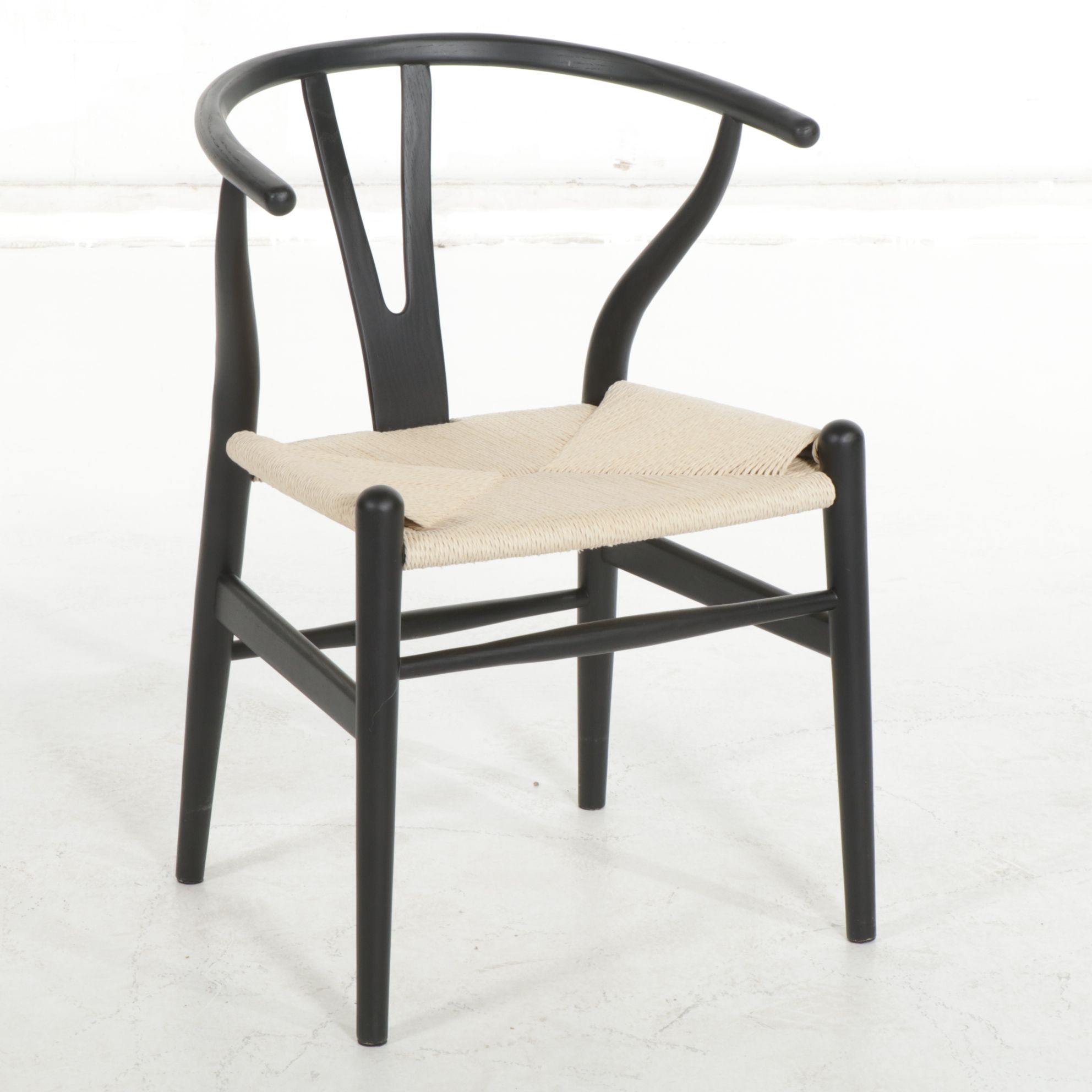 Four Modernist Black Wishbone Style Dining Chairs with Twisted Cord Seats