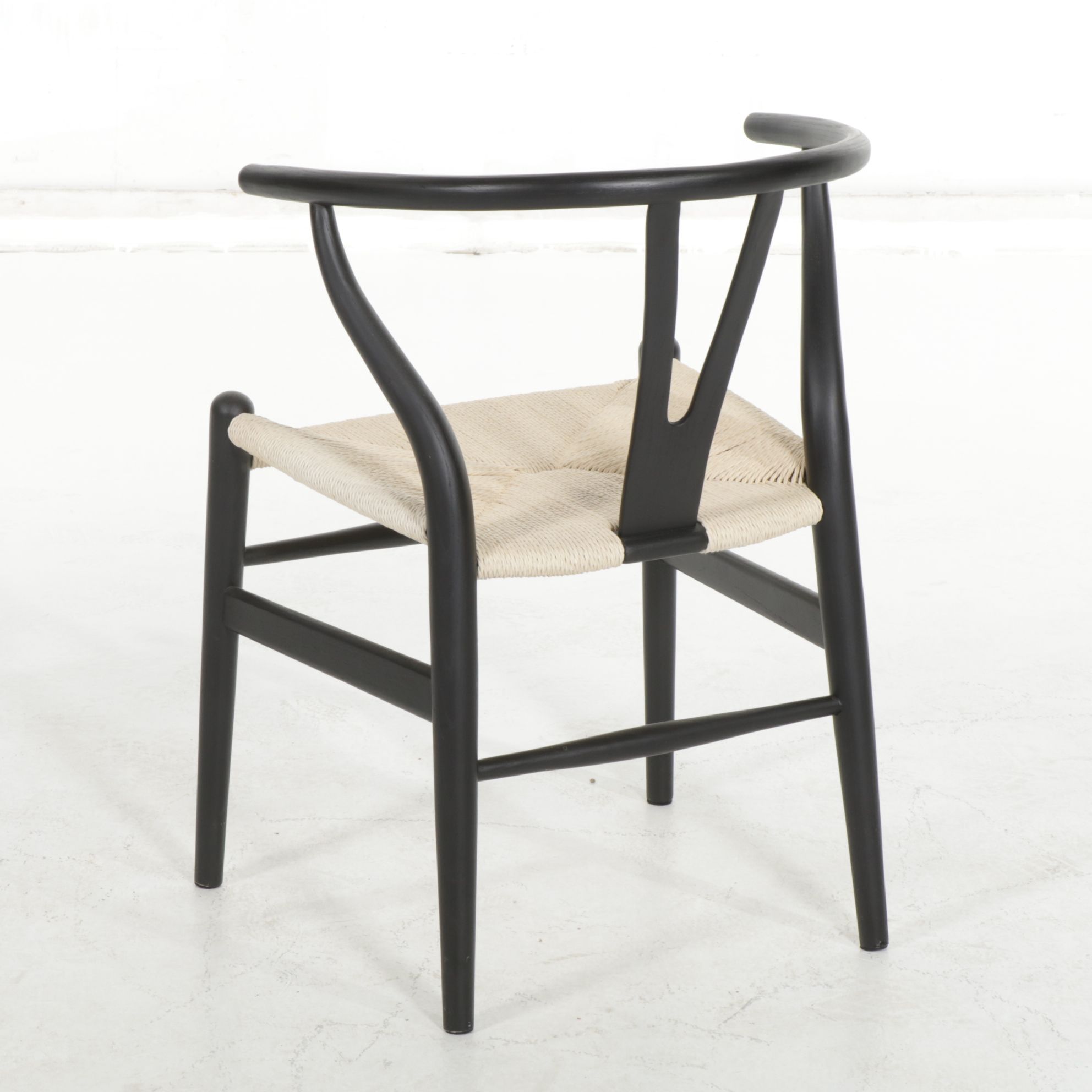 Four Modernist Black Wishbone Style Dining Chairs with Twisted Cord Seats