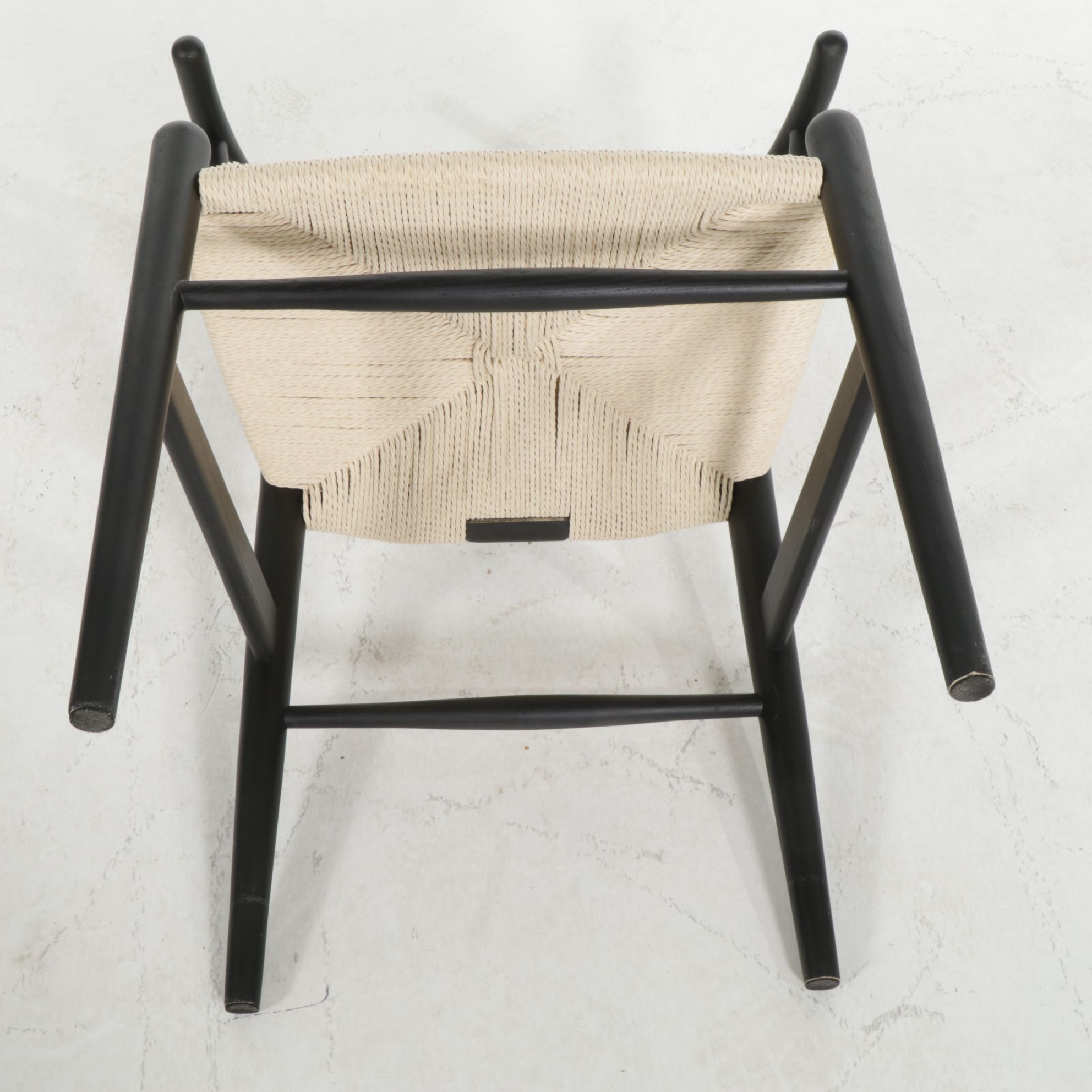 Four Modernist Black Wishbone Style Dining Chairs with Twisted Cord Seats