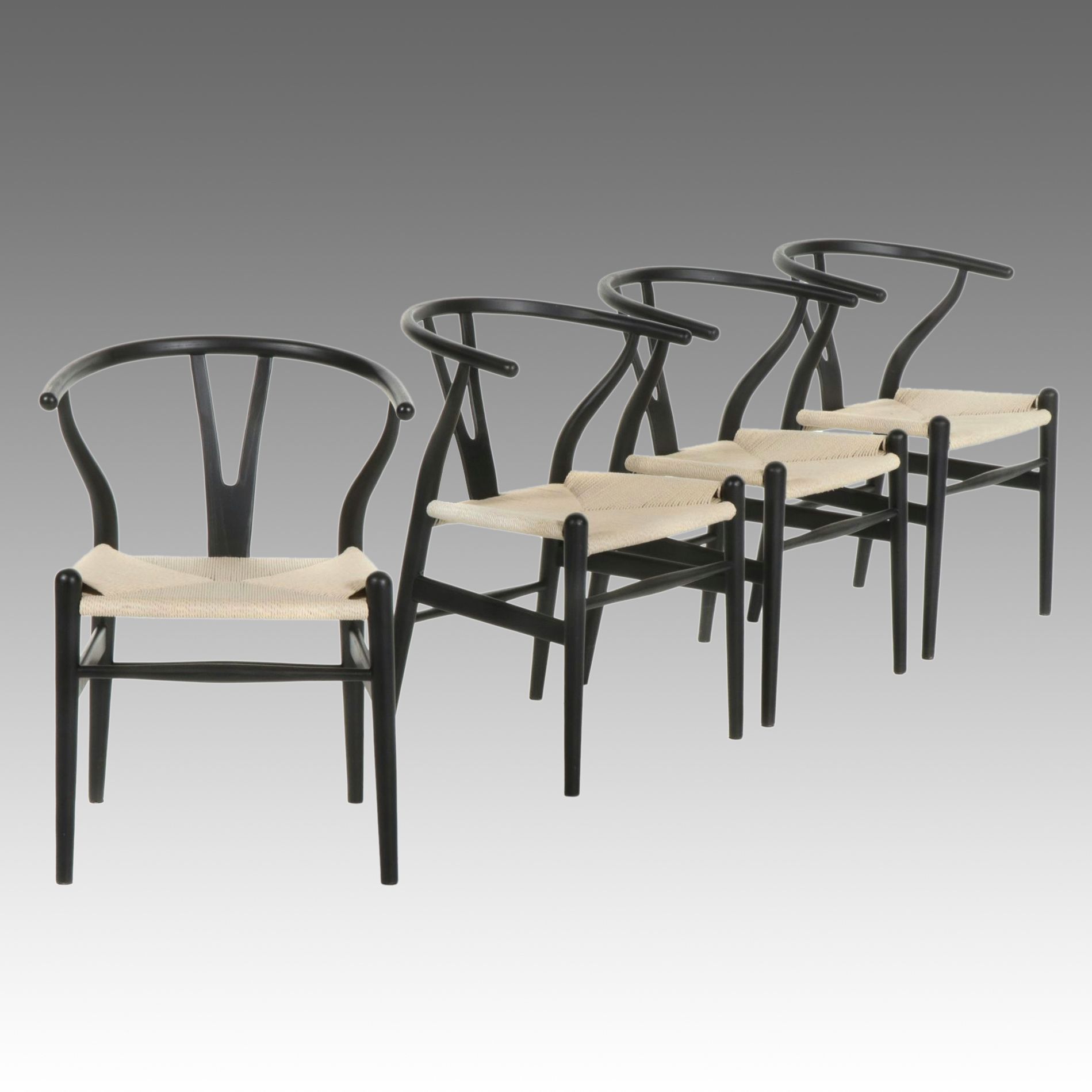 Four Modernist Black Wishbone Style Dining Chairs with Twisted Cord Seats