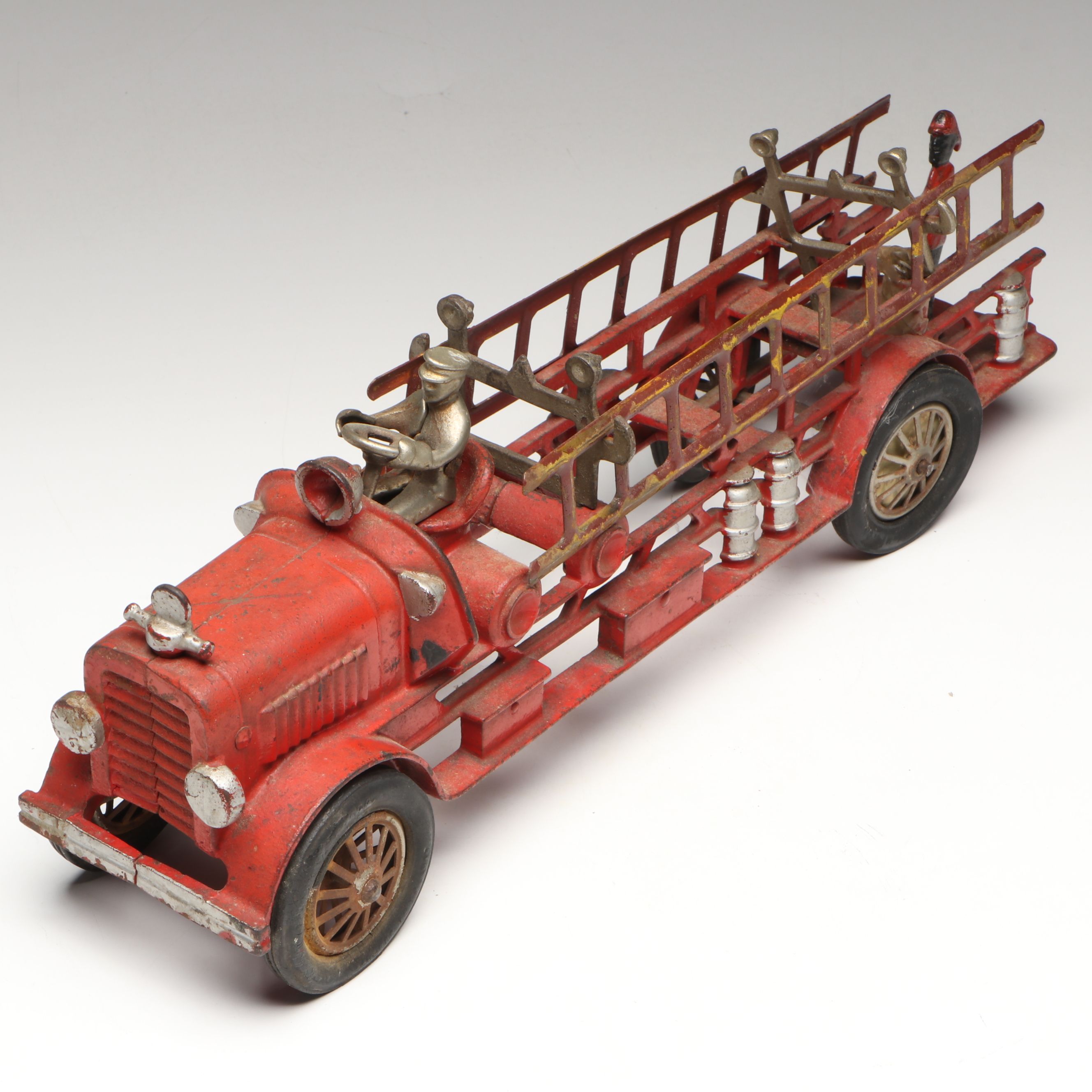 Hubley Cast Iron Cold-Painted Fire Ladder Truck with Driver, Early 20th Century