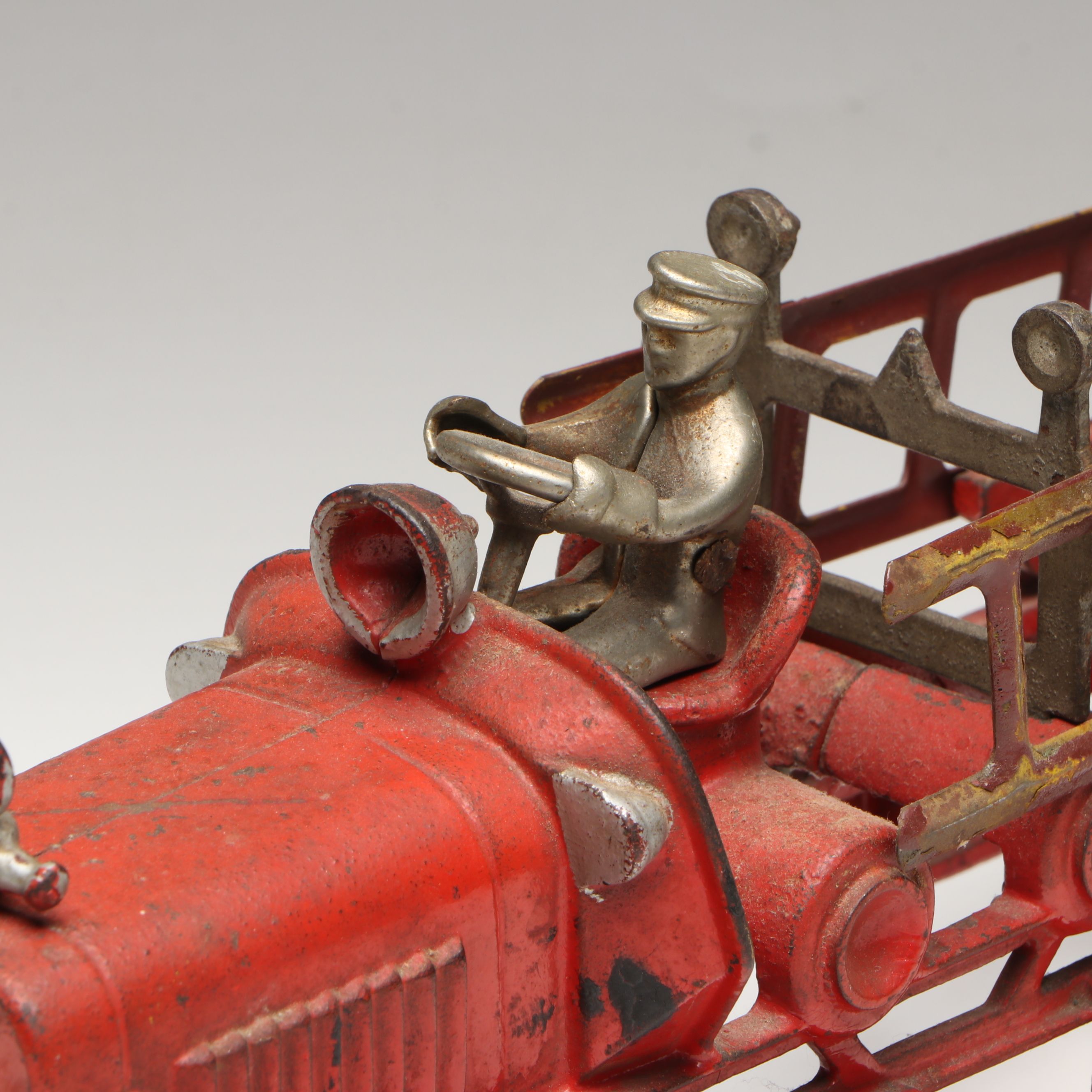 Hubley Cast Iron Cold-Painted Fire Ladder Truck with Driver, Early 20th Century