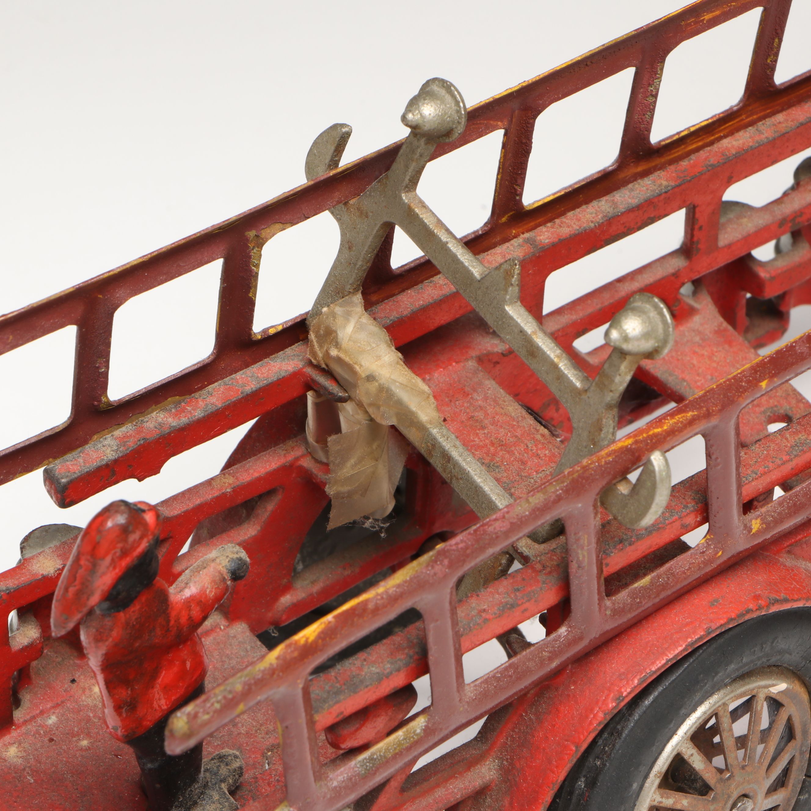 Hubley Cast Iron Cold-Painted Fire Ladder Truck with Driver, Early 20th Century