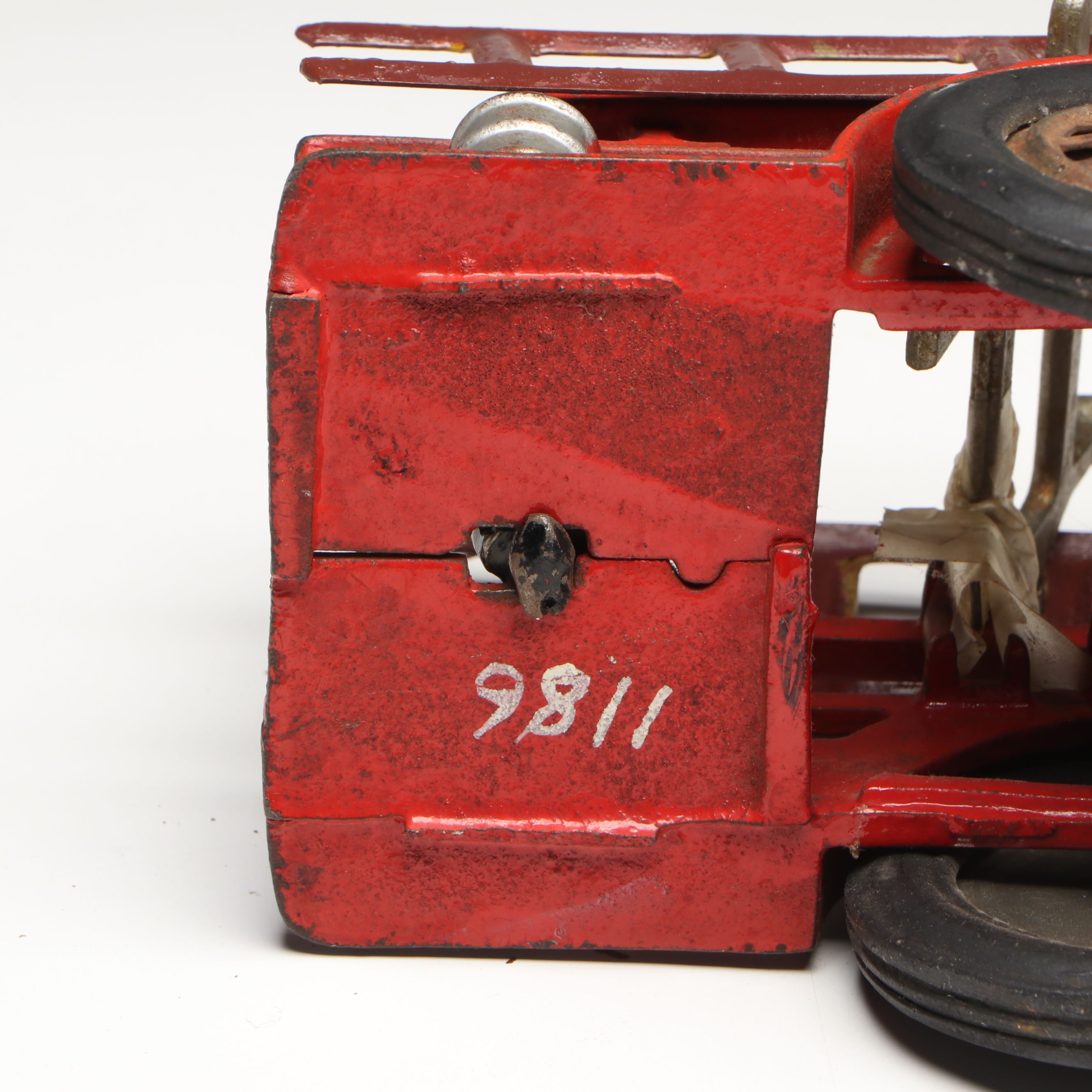 Hubley Cast Iron Cold-Painted Fire Ladder Truck with Driver, Early 20th Century