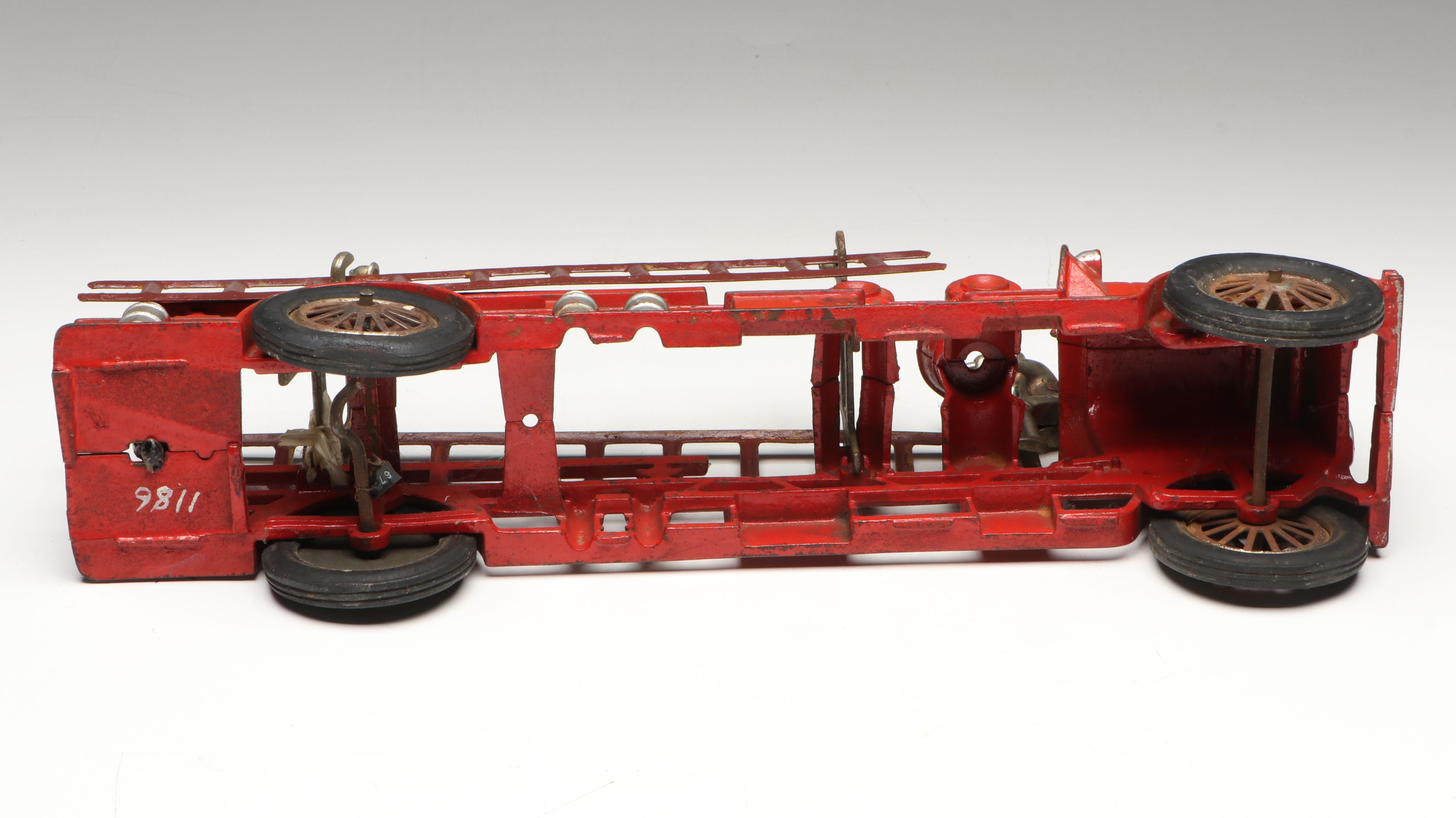 Hubley Cast Iron Cold-Painted Fire Ladder Truck with Driver, Early 20th Century