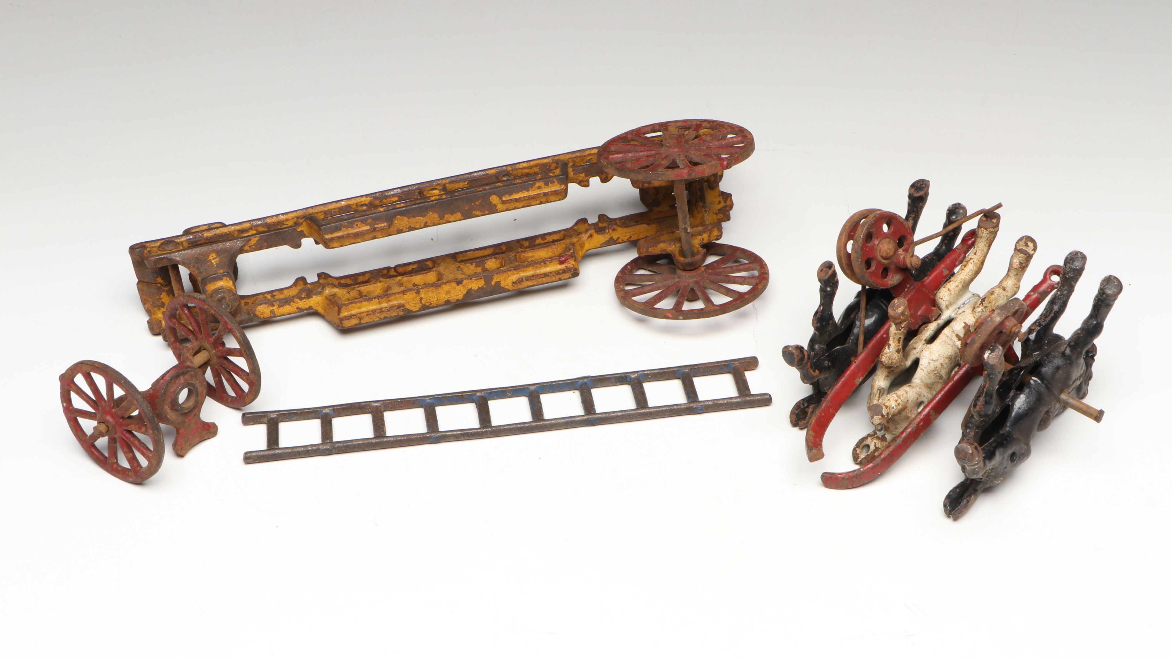 Hubley Cast Iron Horse-Drawn Fire Ladder and Water Wagon Toys