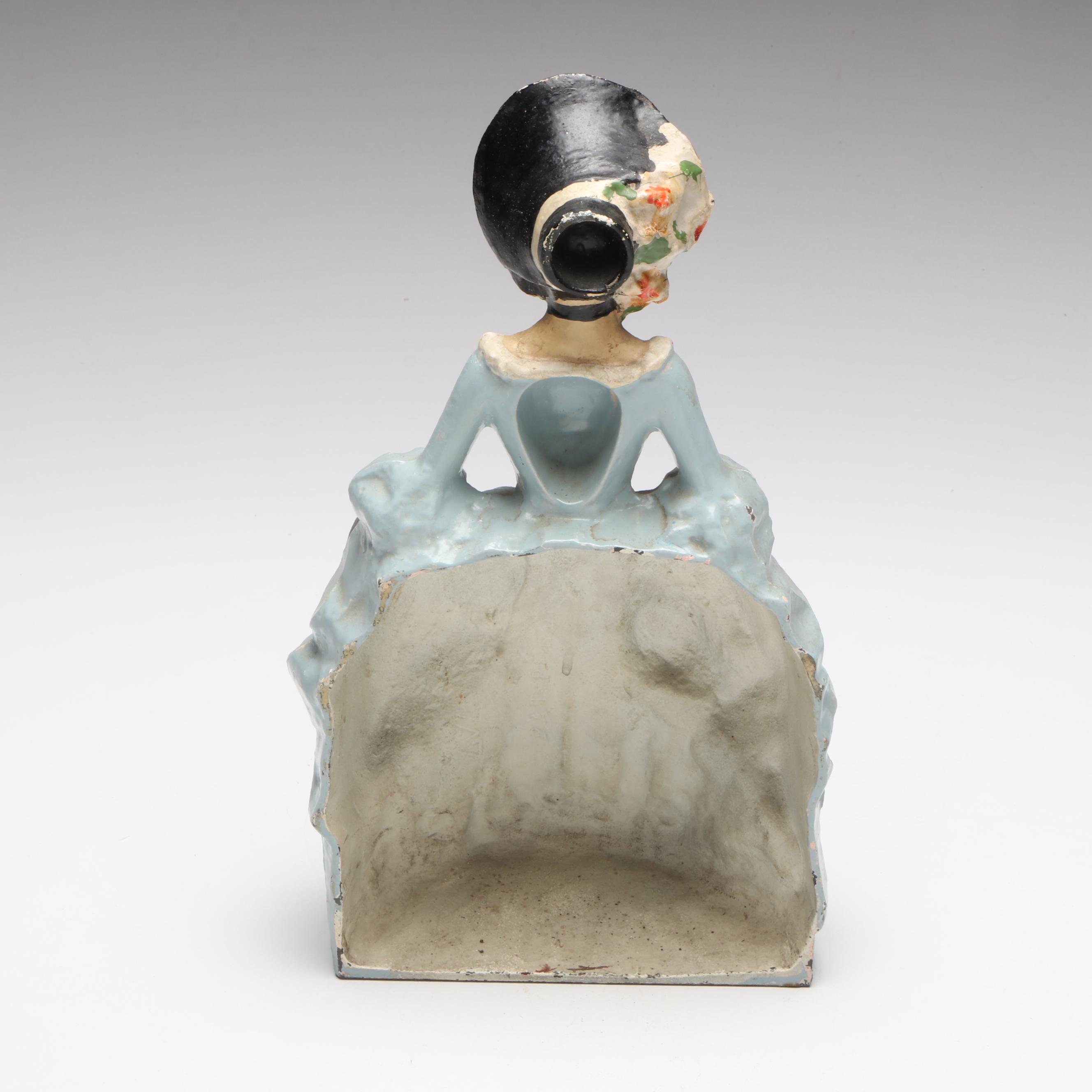 LVL Colonial Woman Cold-Painted Cast Iron Doorstop, c. 1920
