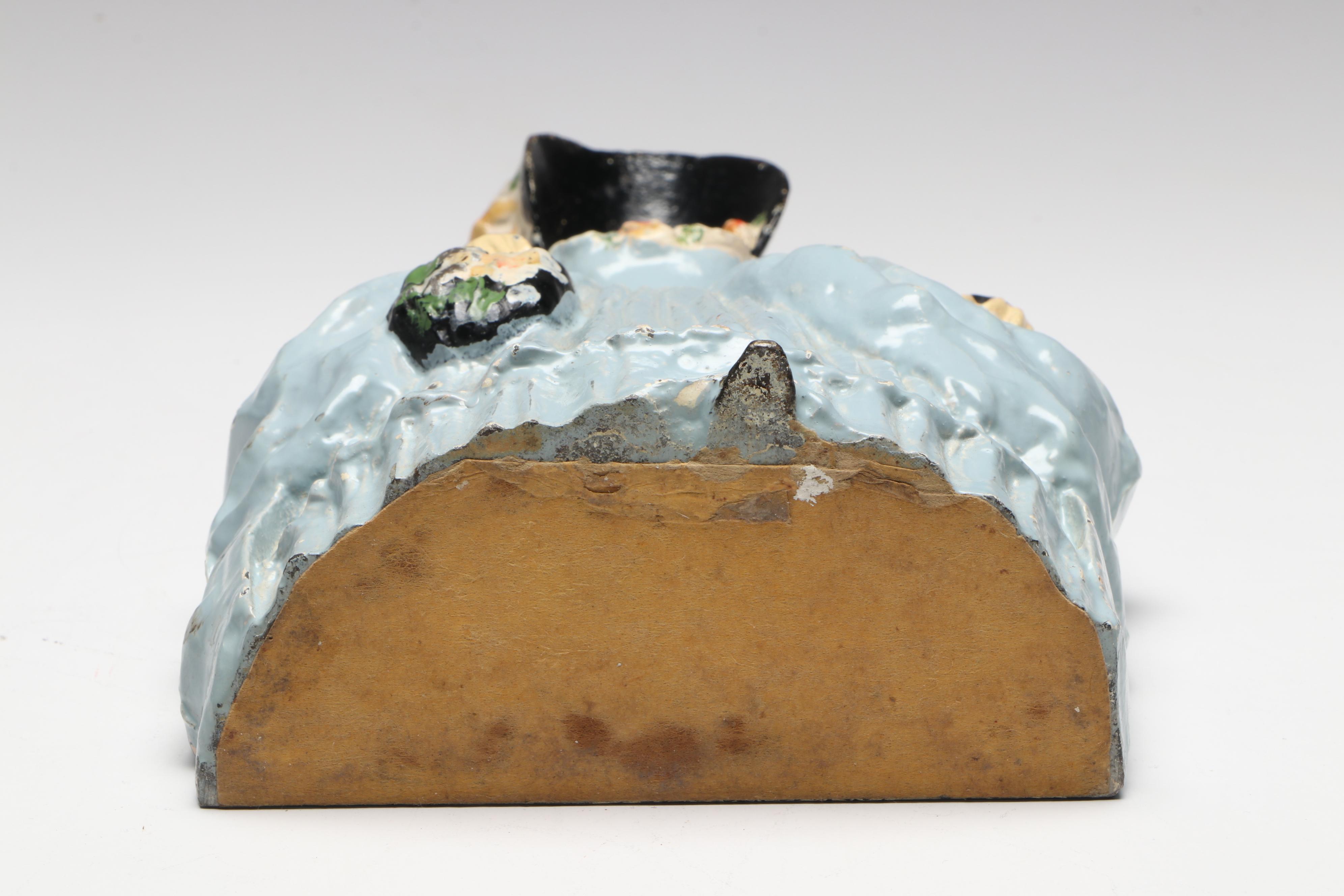 LVL Colonial Woman Cold-Painted Cast Iron Doorstop, c. 1920