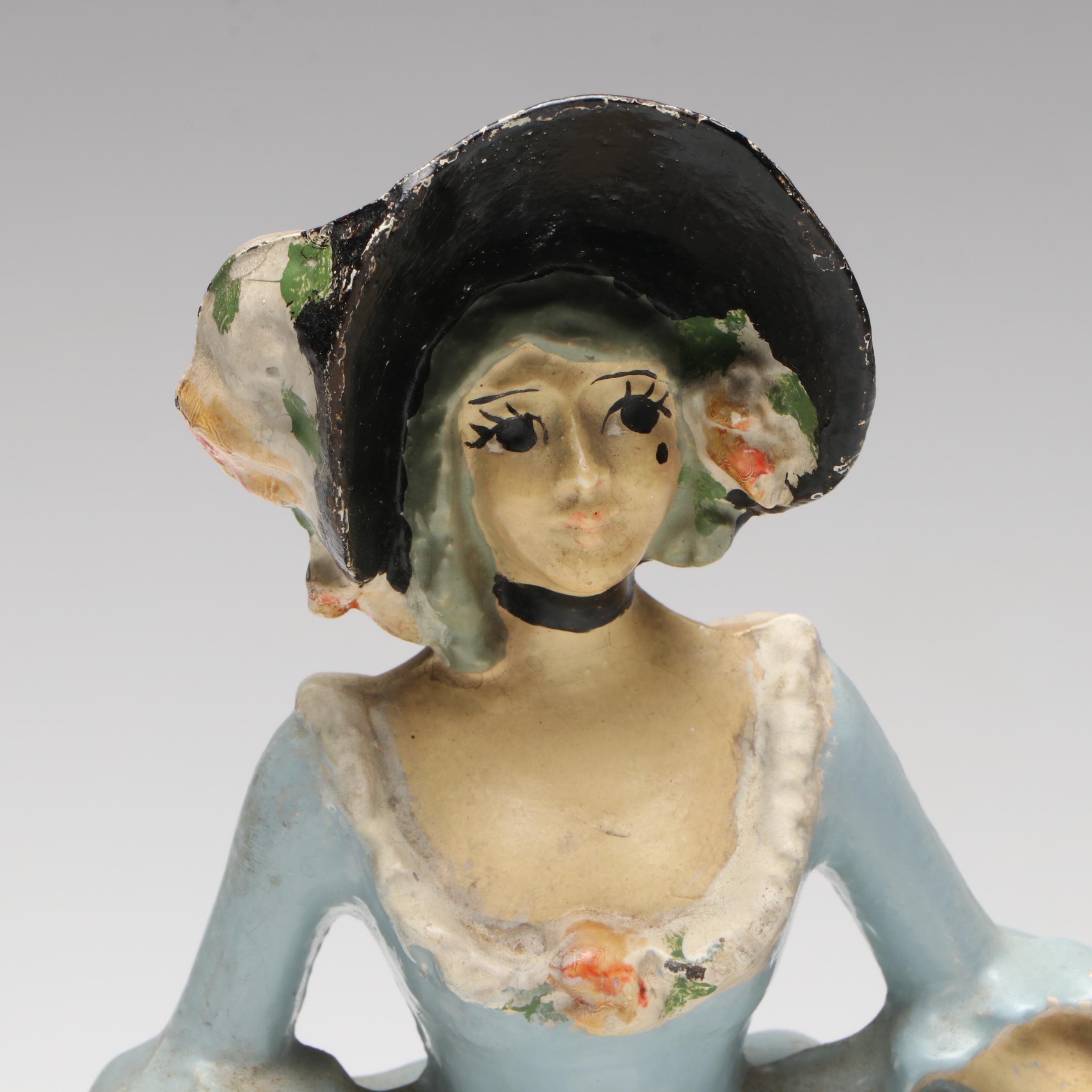 LVL Colonial Woman Cold-Painted Cast Iron Doorstop, c. 1920