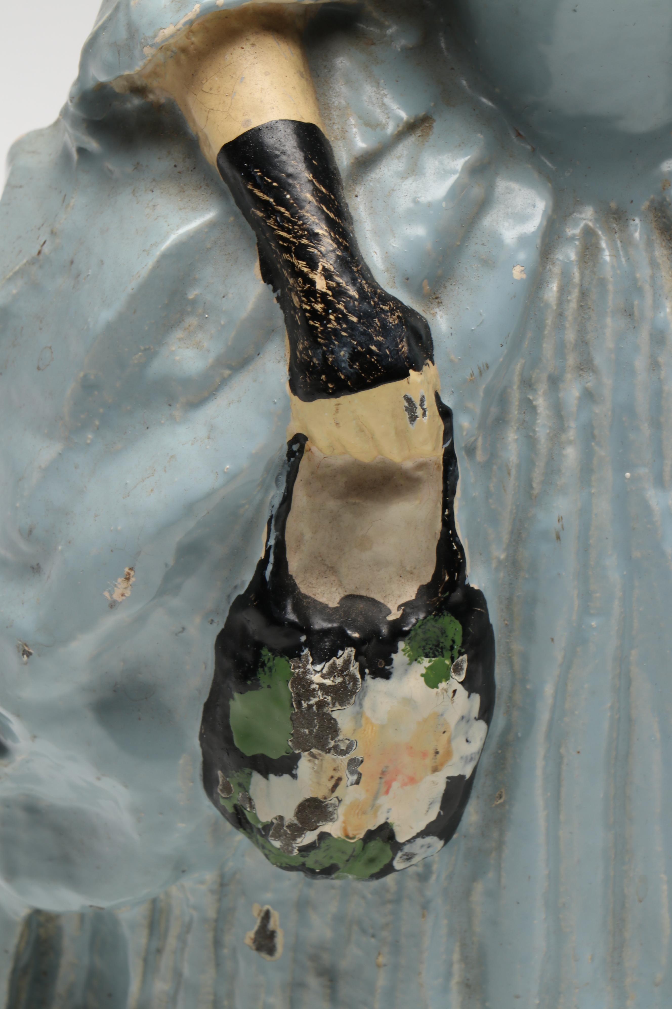 LVL Colonial Woman Cold-Painted Cast Iron Doorstop, c. 1920