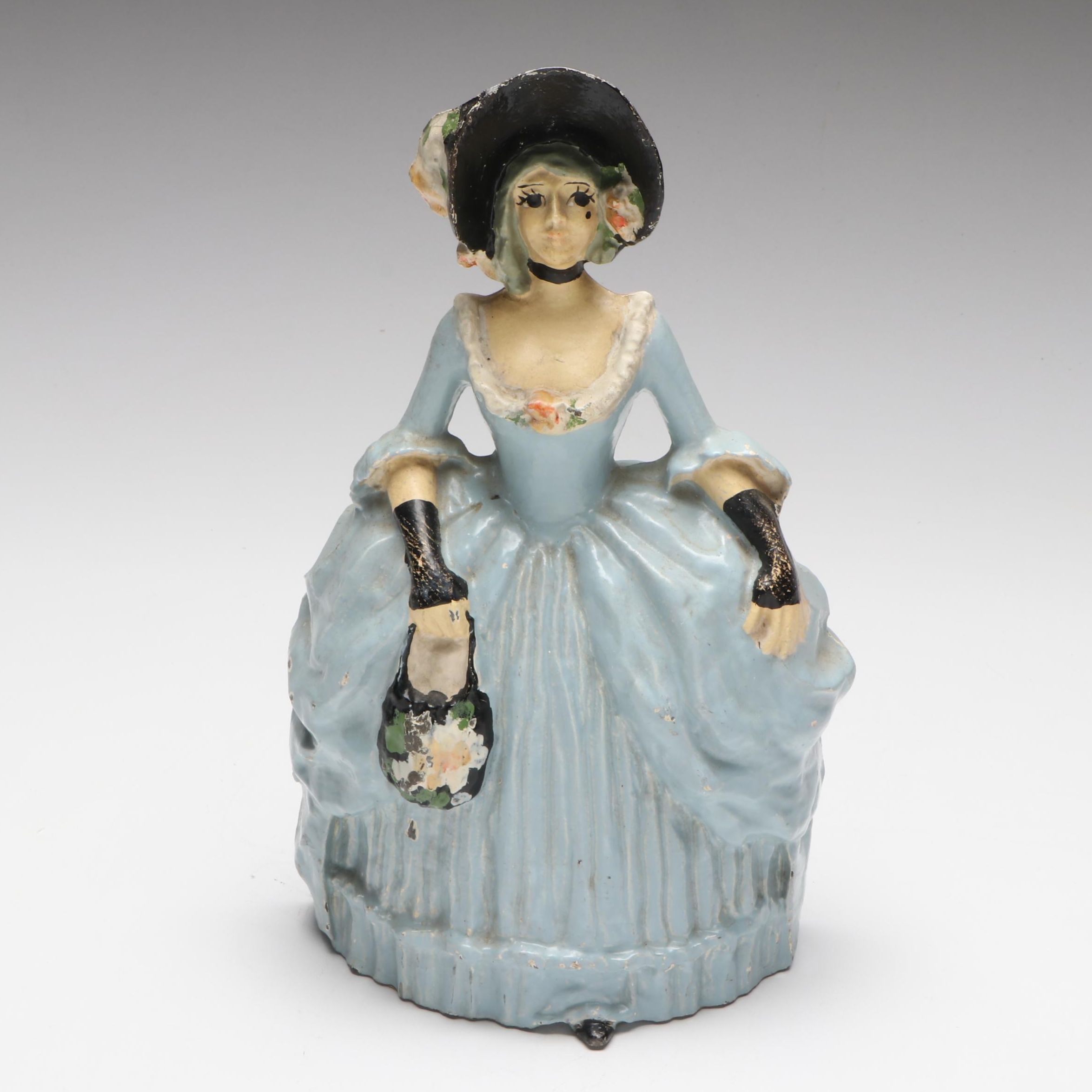 LVL Colonial Woman Cold-Painted Cast Iron Doorstop, c. 1920