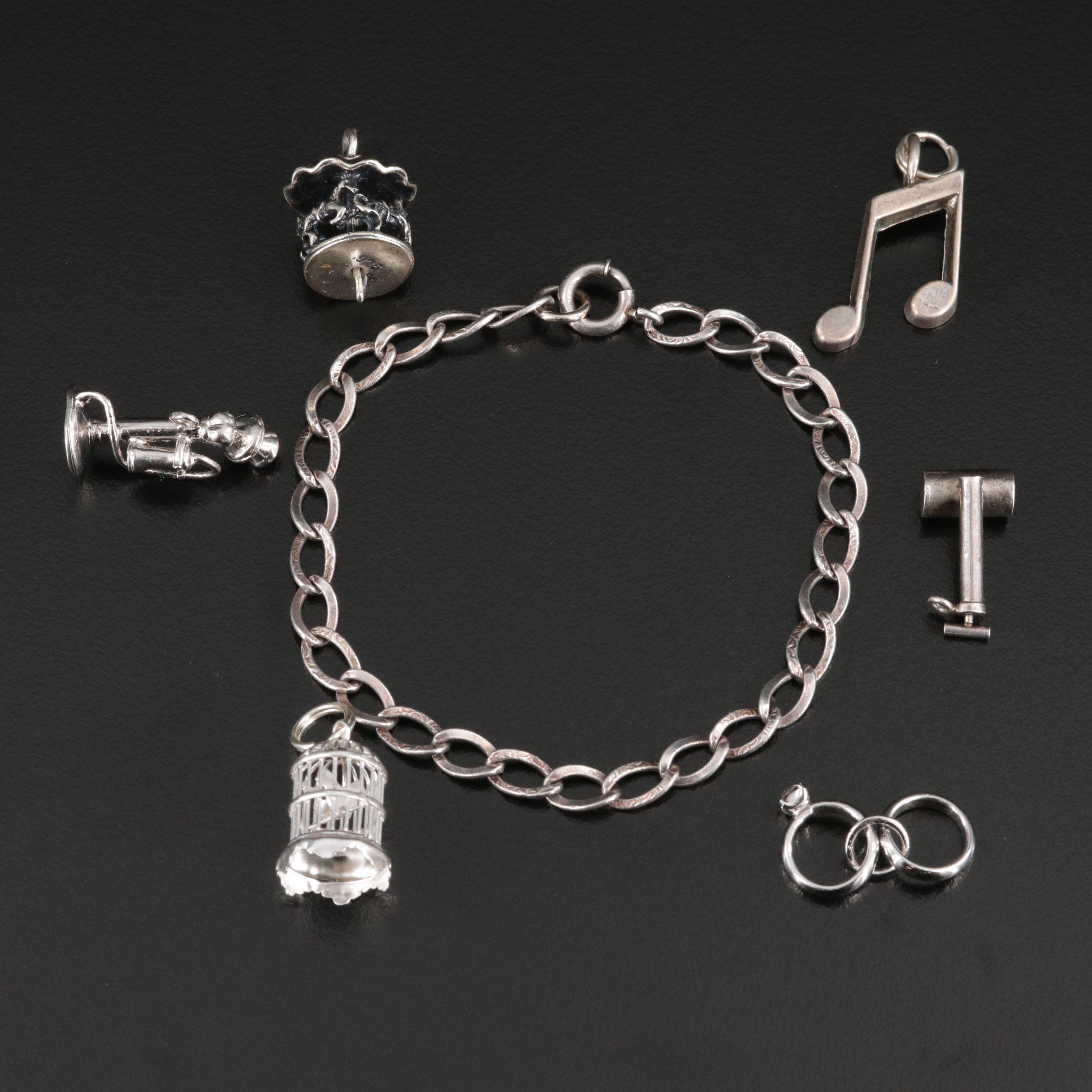 Sterling Bracelet and Charms Featuring Articulation