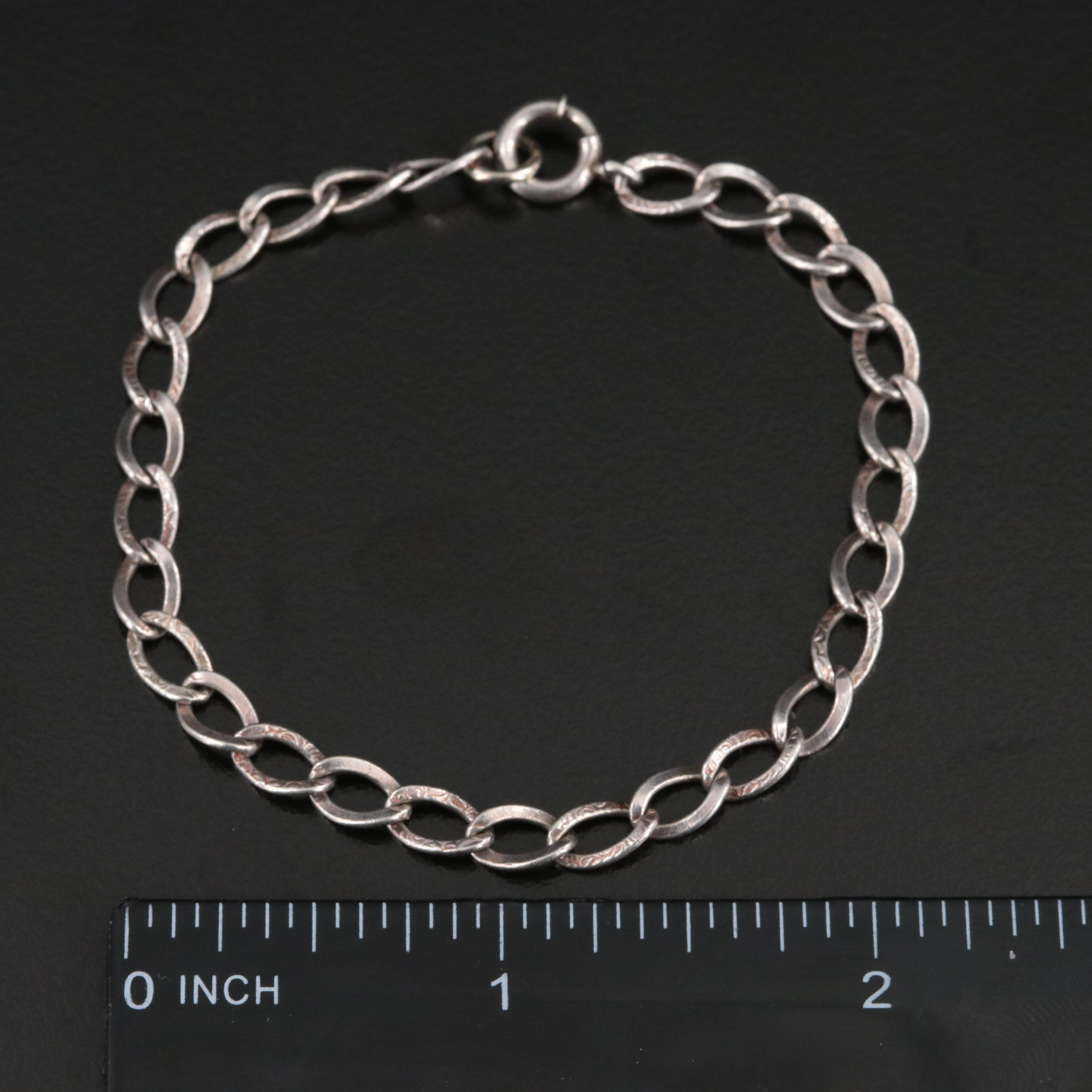 Sterling Bracelet and Charms Featuring Articulation