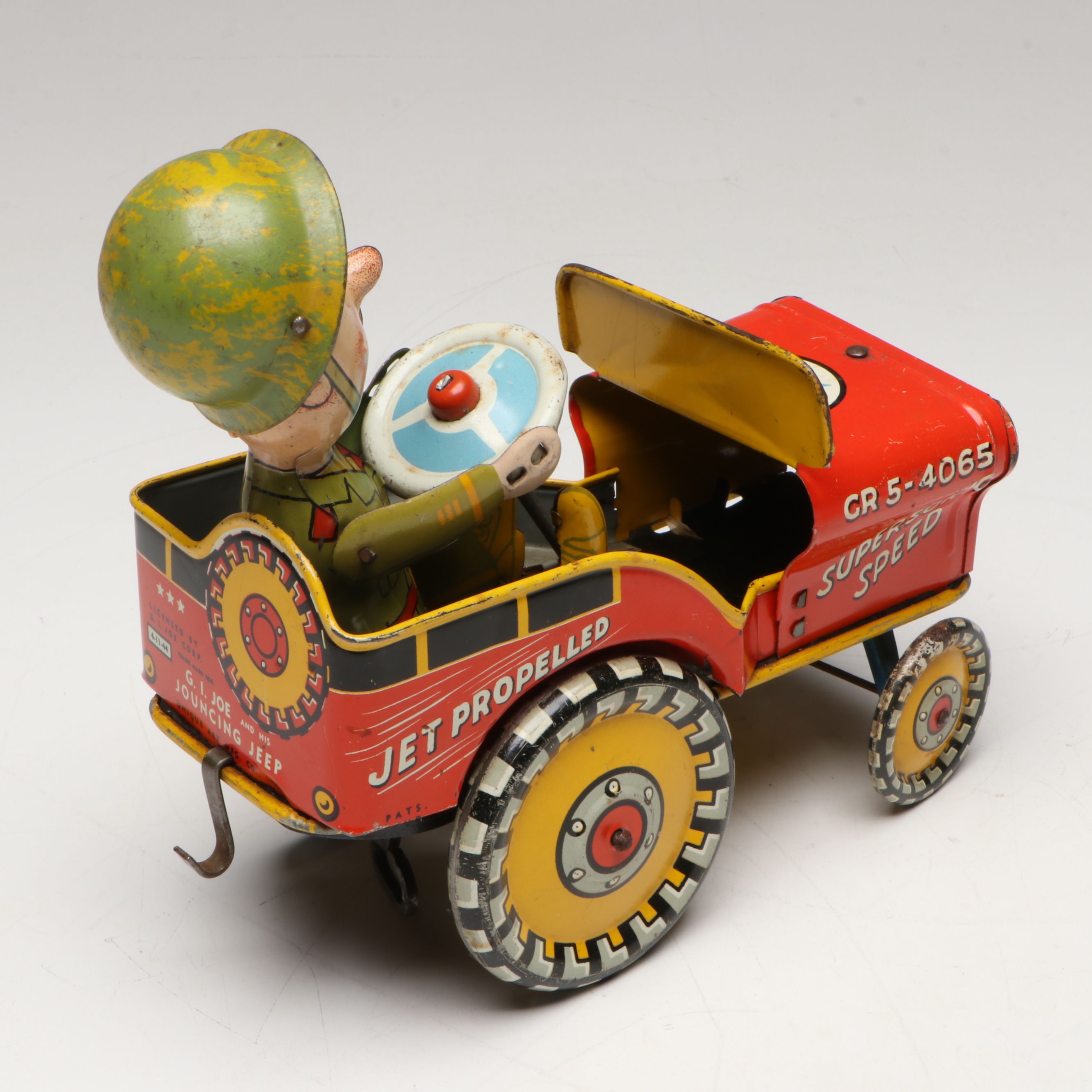 Unique Art "G.I. Joe and His Jouncing Jeep" Tin Lithograph Wind-Up Toy, 1940s