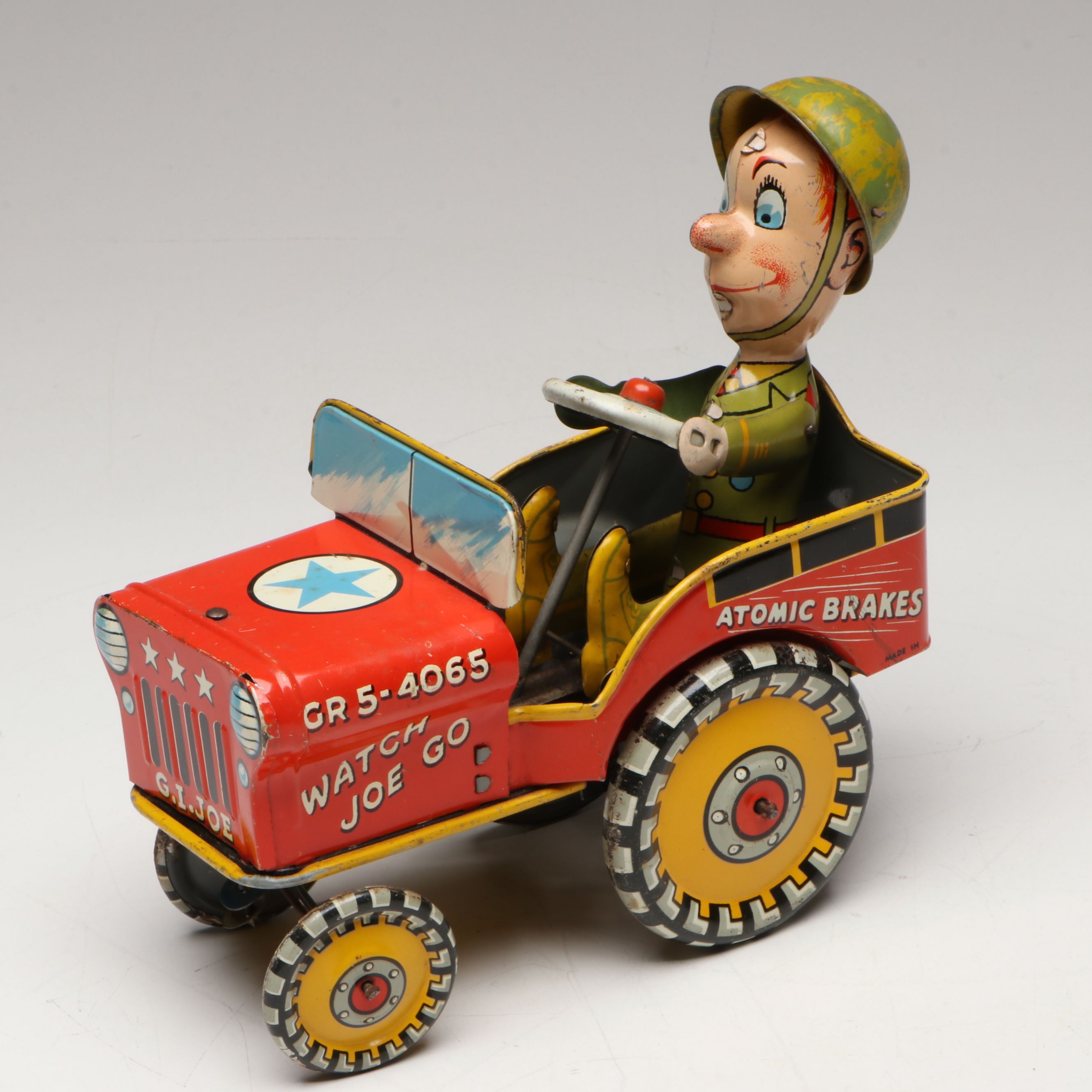 Unique Art "G.I. Joe and His Jouncing Jeep" Tin Lithograph Wind-Up Toy, 1940s