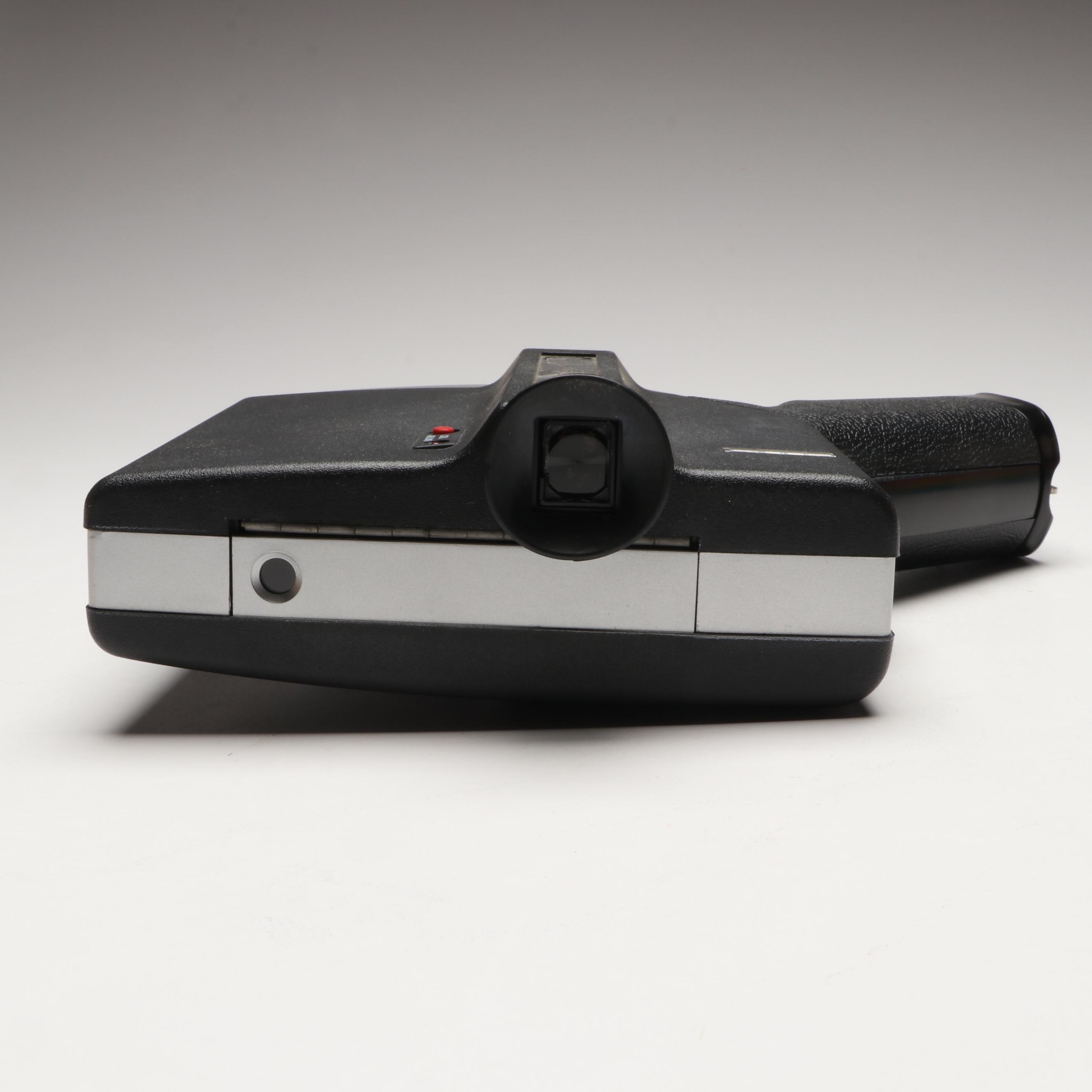 Polaroid "Polavision" Land Camera and Bell & Howell Electric Eye 127