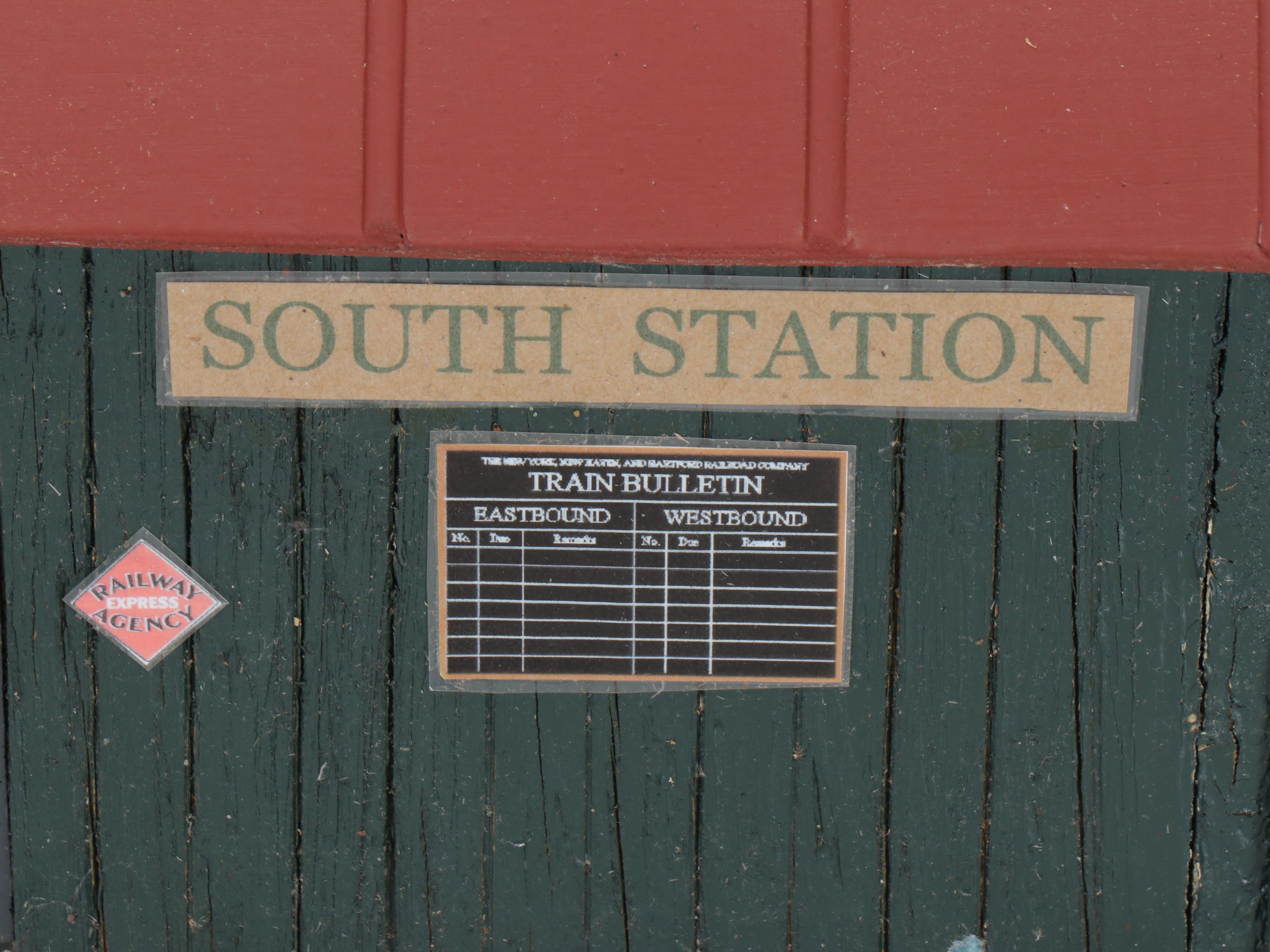 Train Station and Conductor's Building with Water Tower and Other Buildings