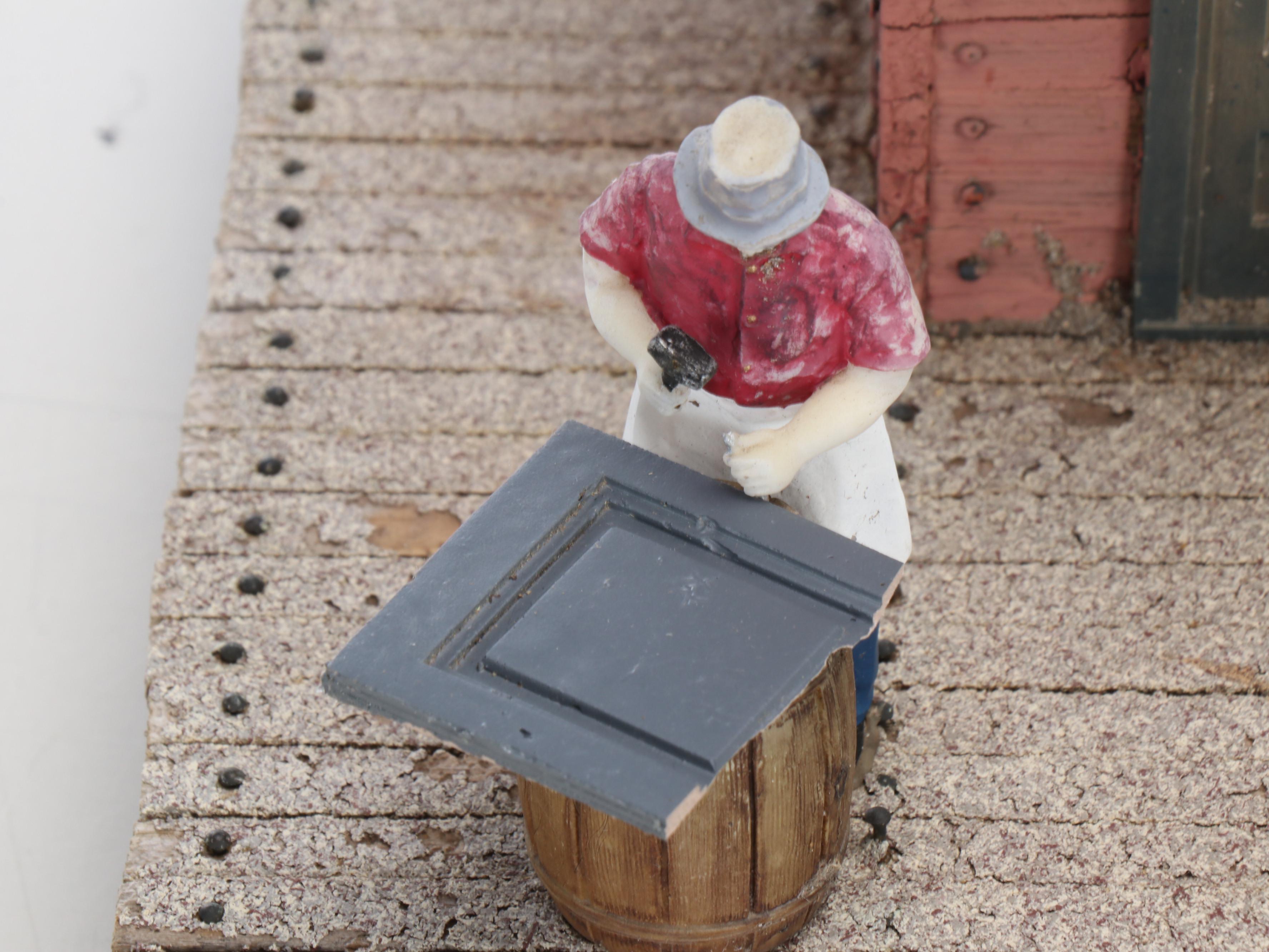 Train Station and Conductor's Building with Water Tower and Other Buildings