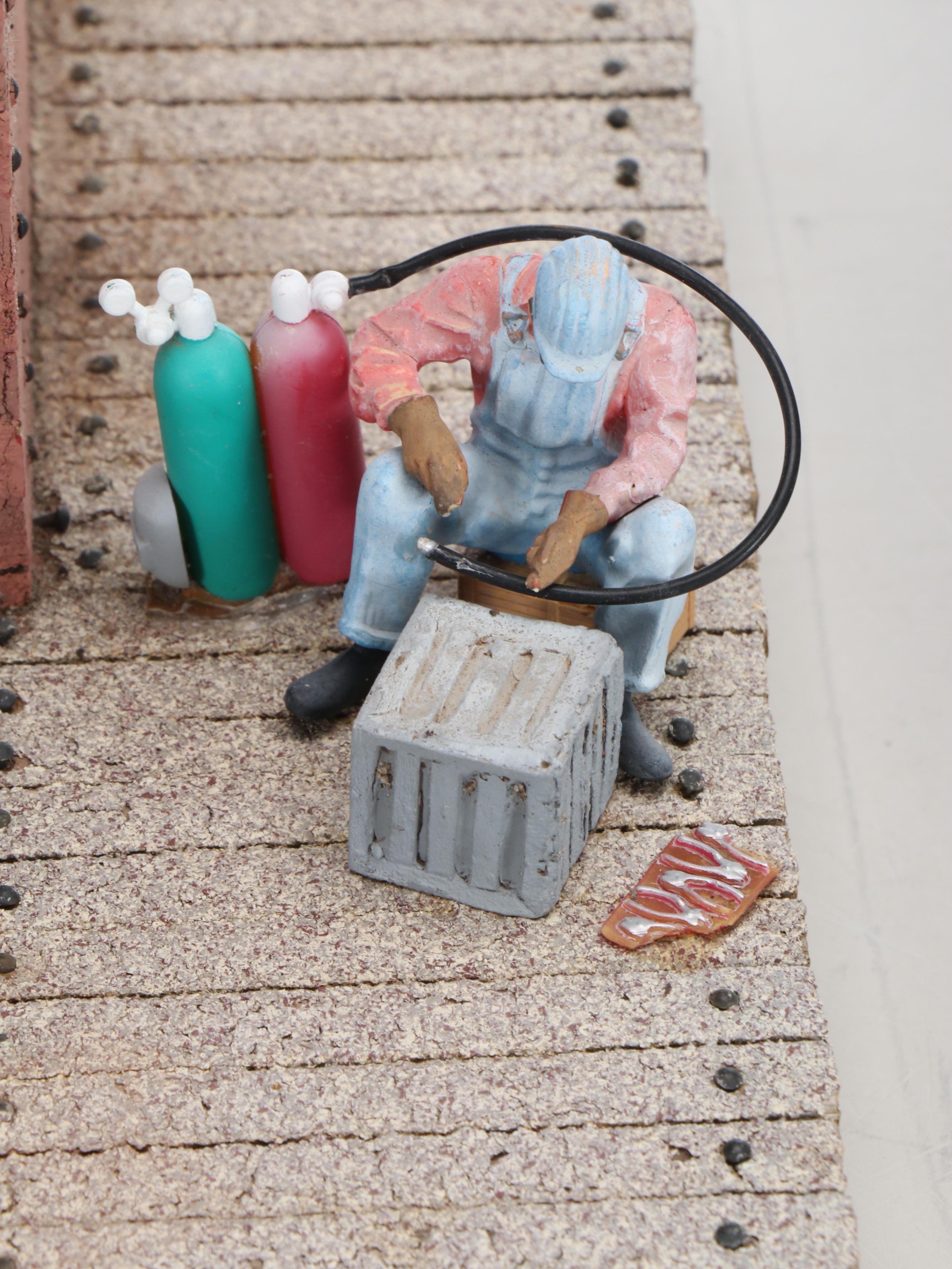 Train Station and Conductor's Building with Water Tower and Other Buildings