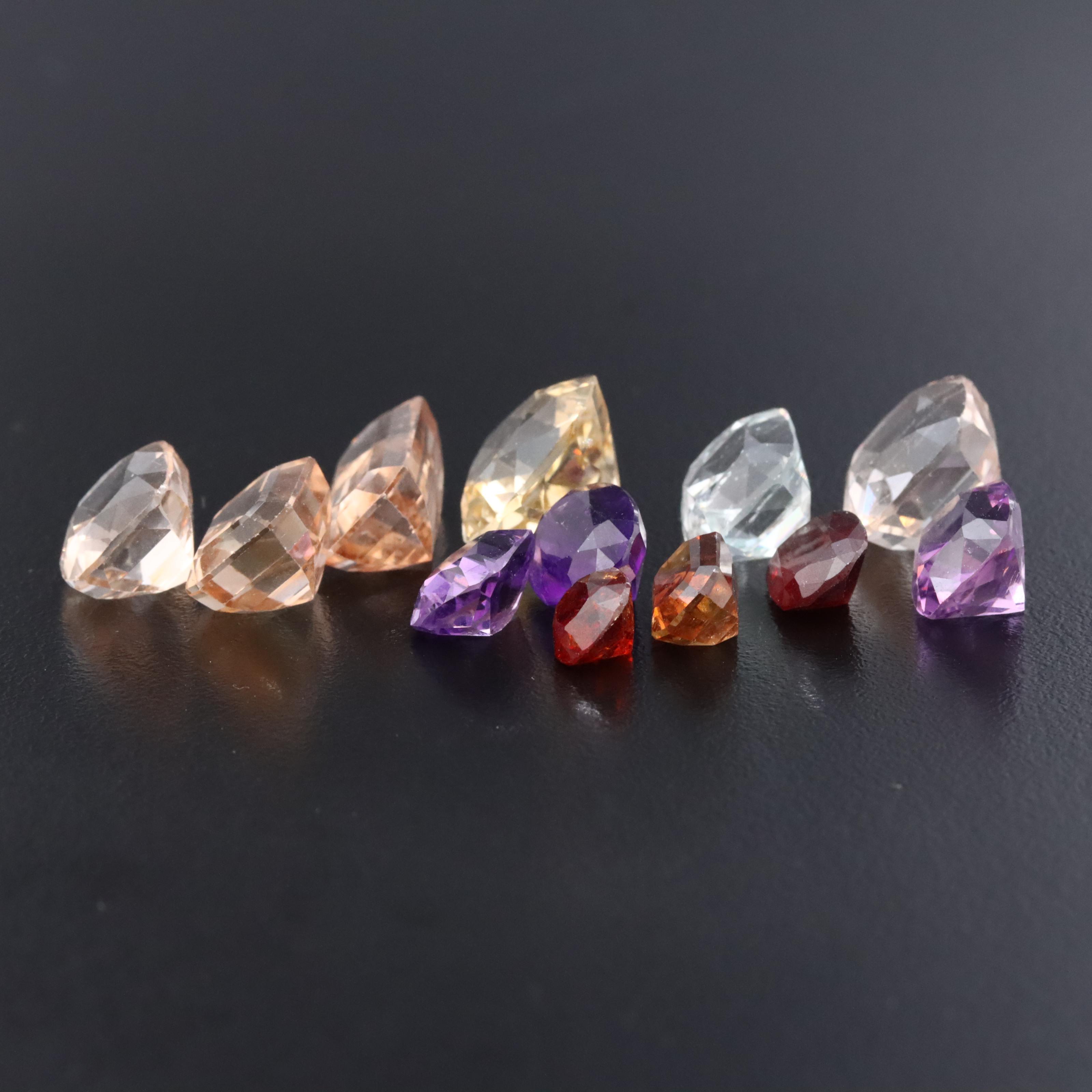 Loose 59.45 CTW Gemstone Lot Featuring Amethyst, Citrine, Garnet