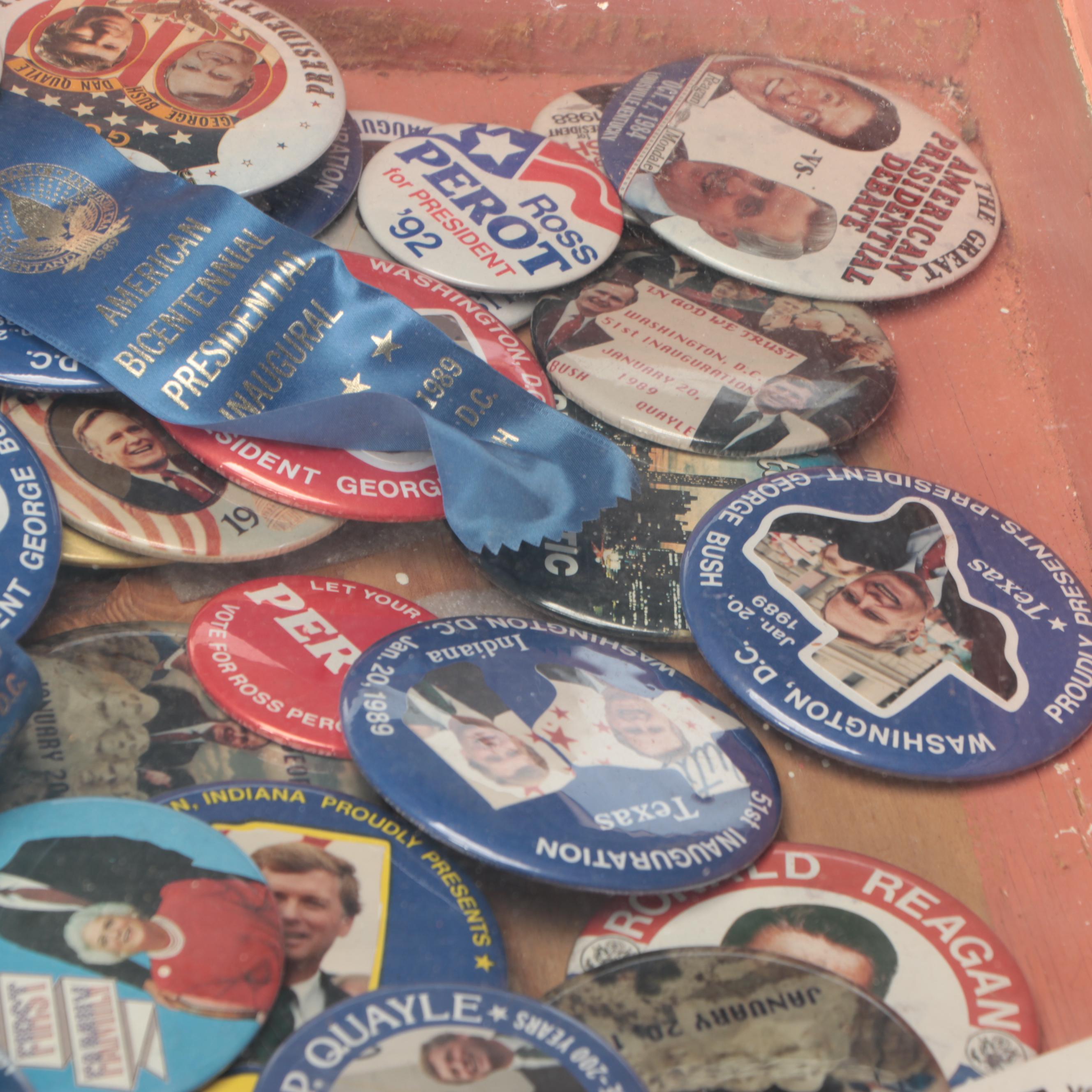 Assortment of Political Campaign Pushback Pins in Wood Cabinet