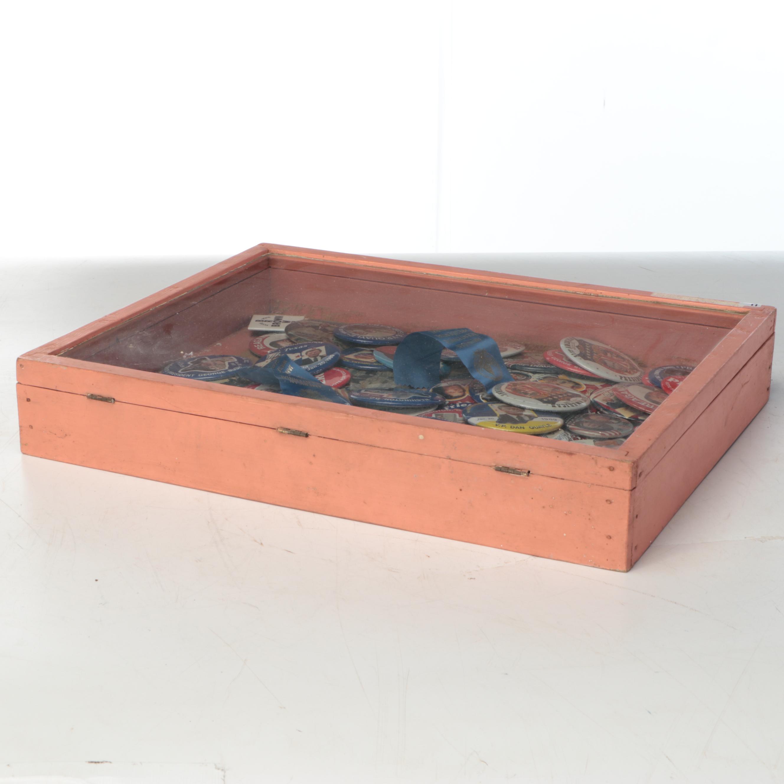 Assortment of Political Campaign Pushback Pins in Wood Cabinet