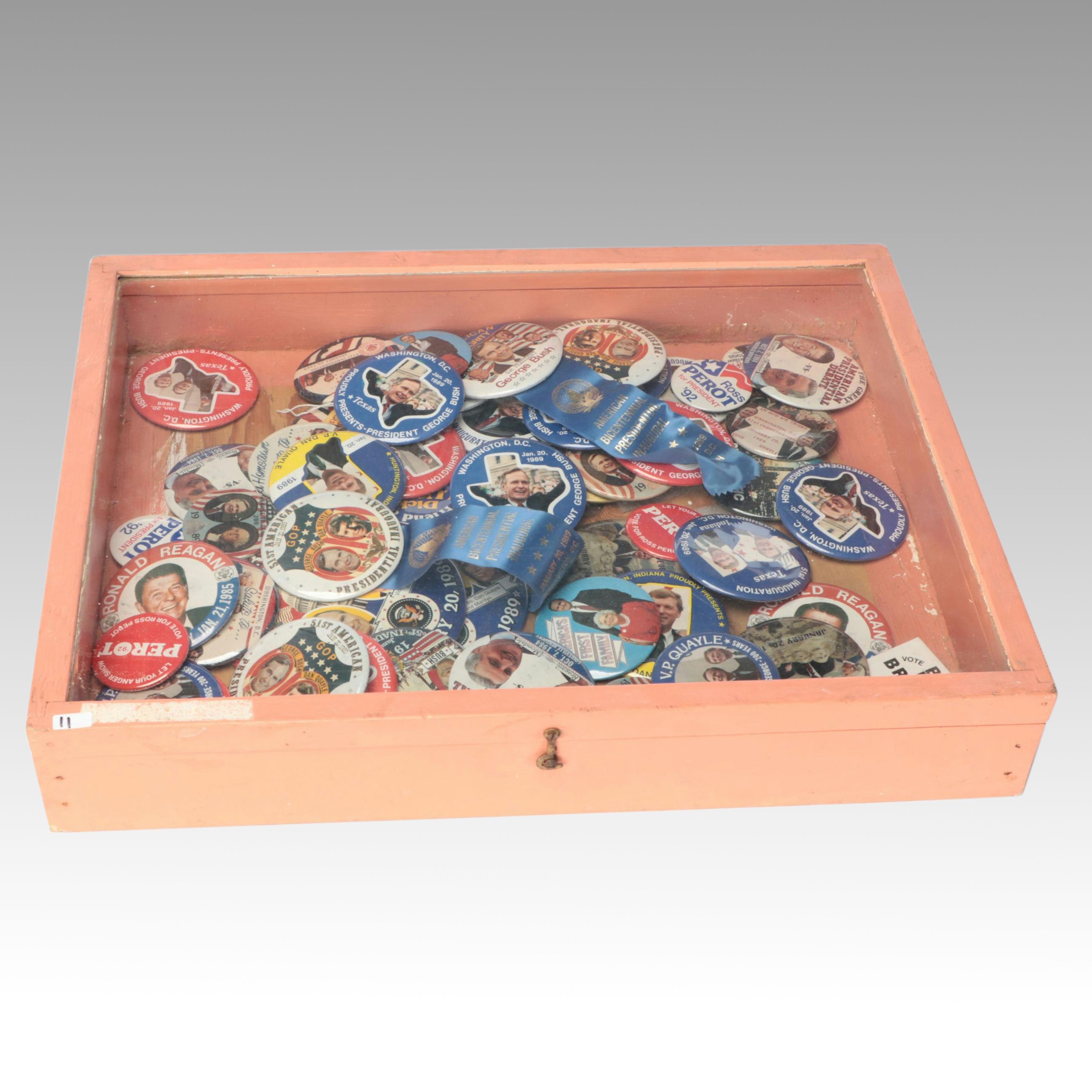 Assortment of Political Campaign Pushback Pins in Wood Cabinet