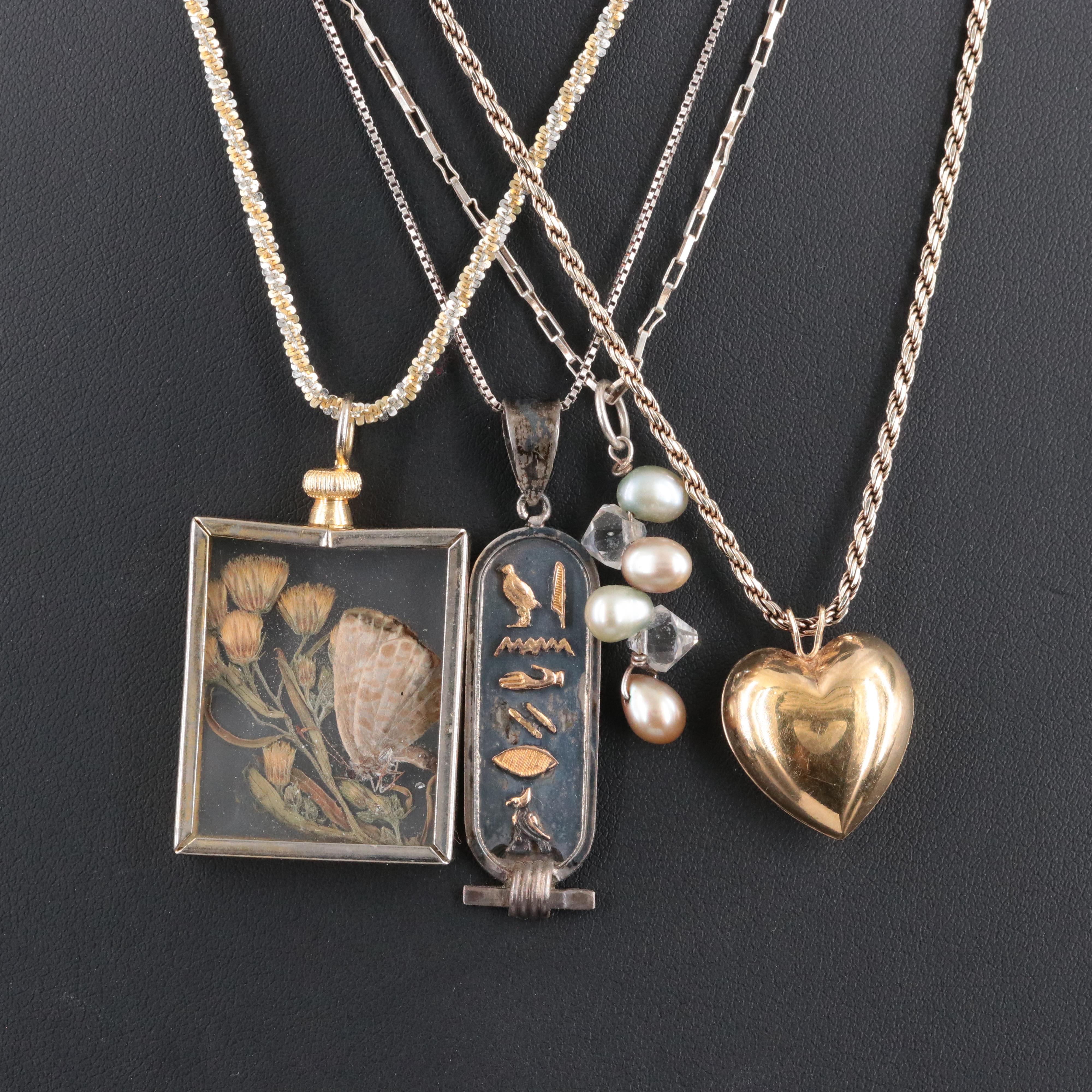 Sterling Chains with Assorted Pendants Featured in Jewelry Collection