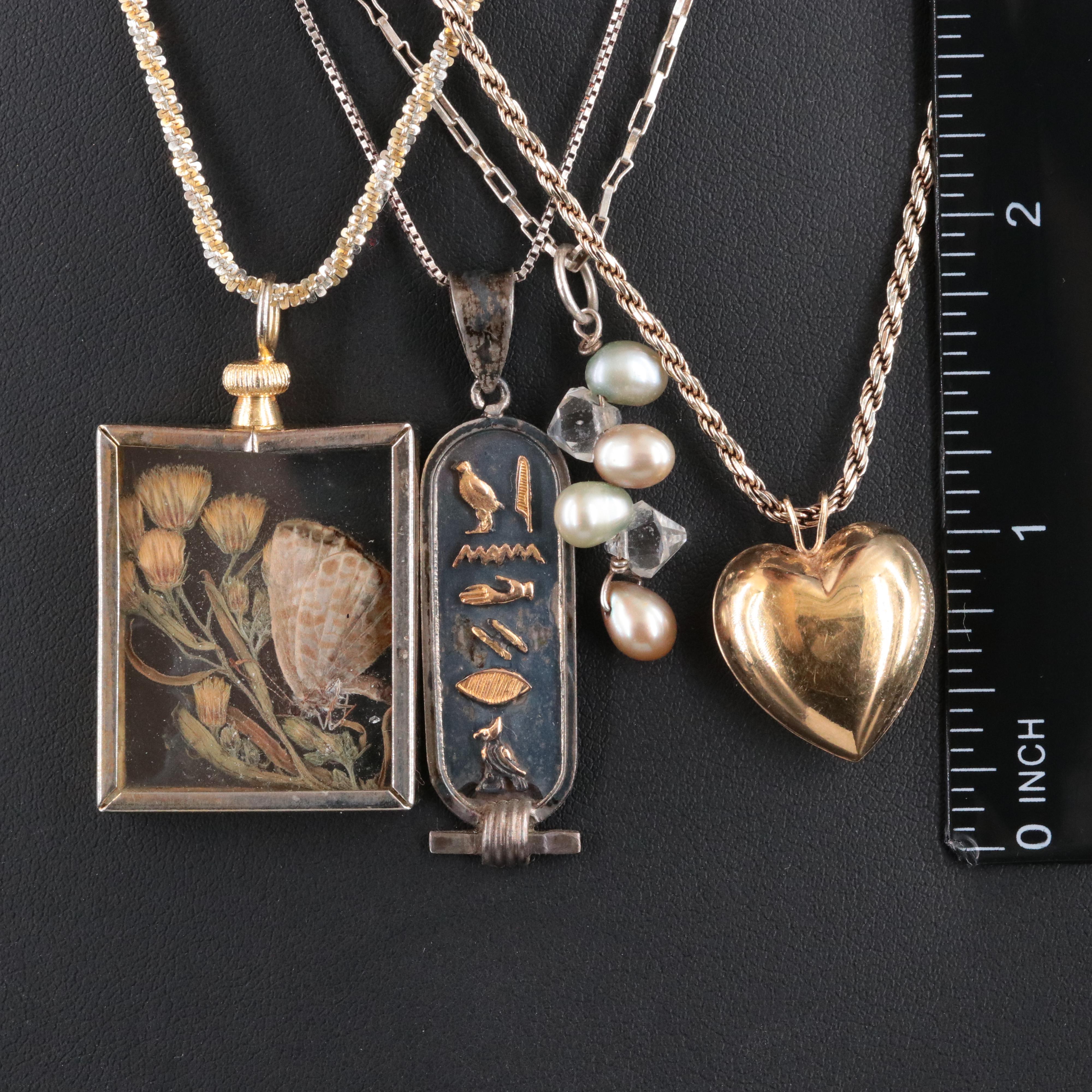 Sterling Chains with Assorted Pendants Featured in Jewelry Collection